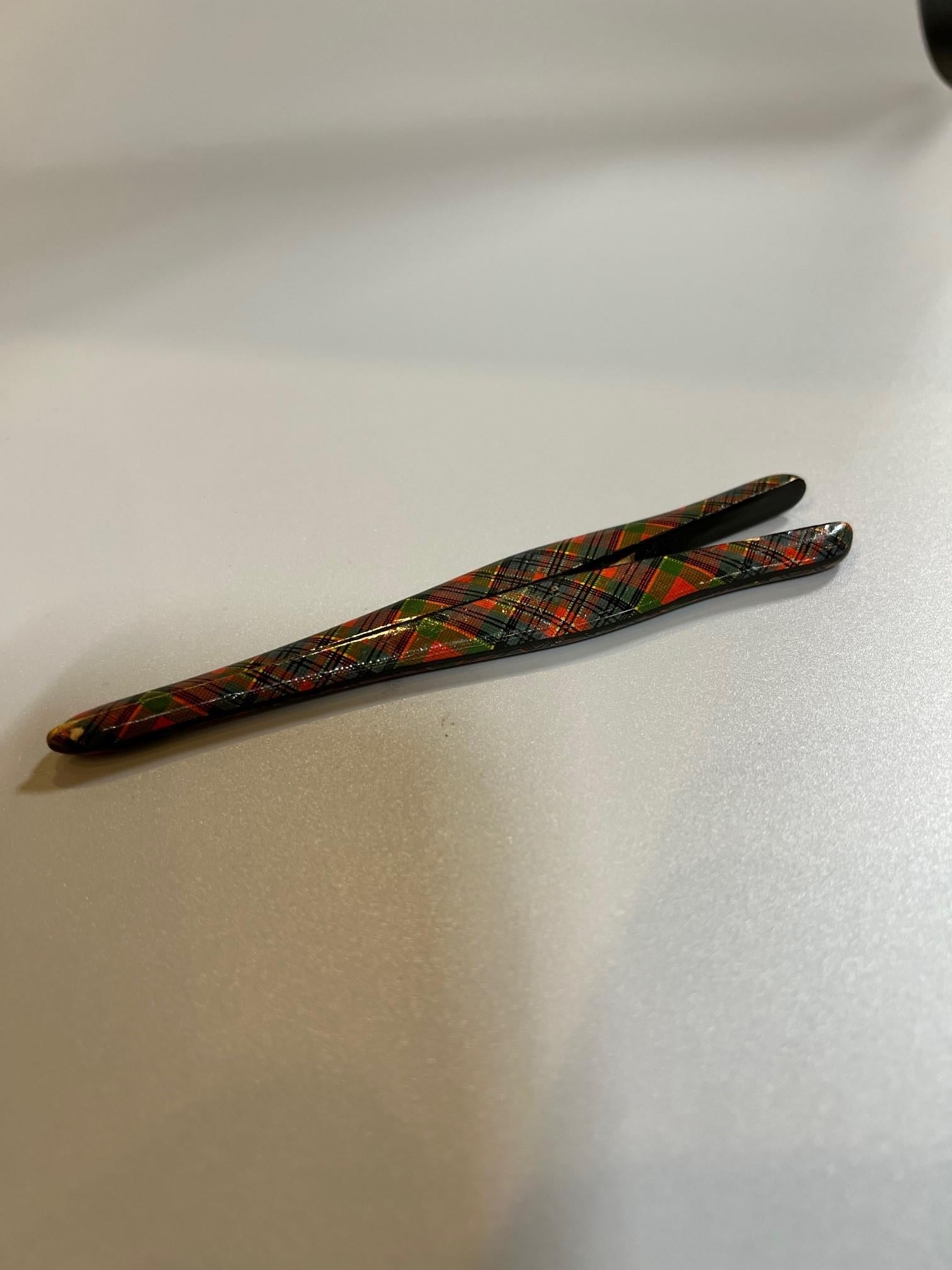 Early 19th century Scottish glove stretcher with a tartan McPherson colors. Tartan also called plaid which refers to Scottish clan colors. This is a rare piece from a private collector who traveled the world buying unusual and hard to find pieces.