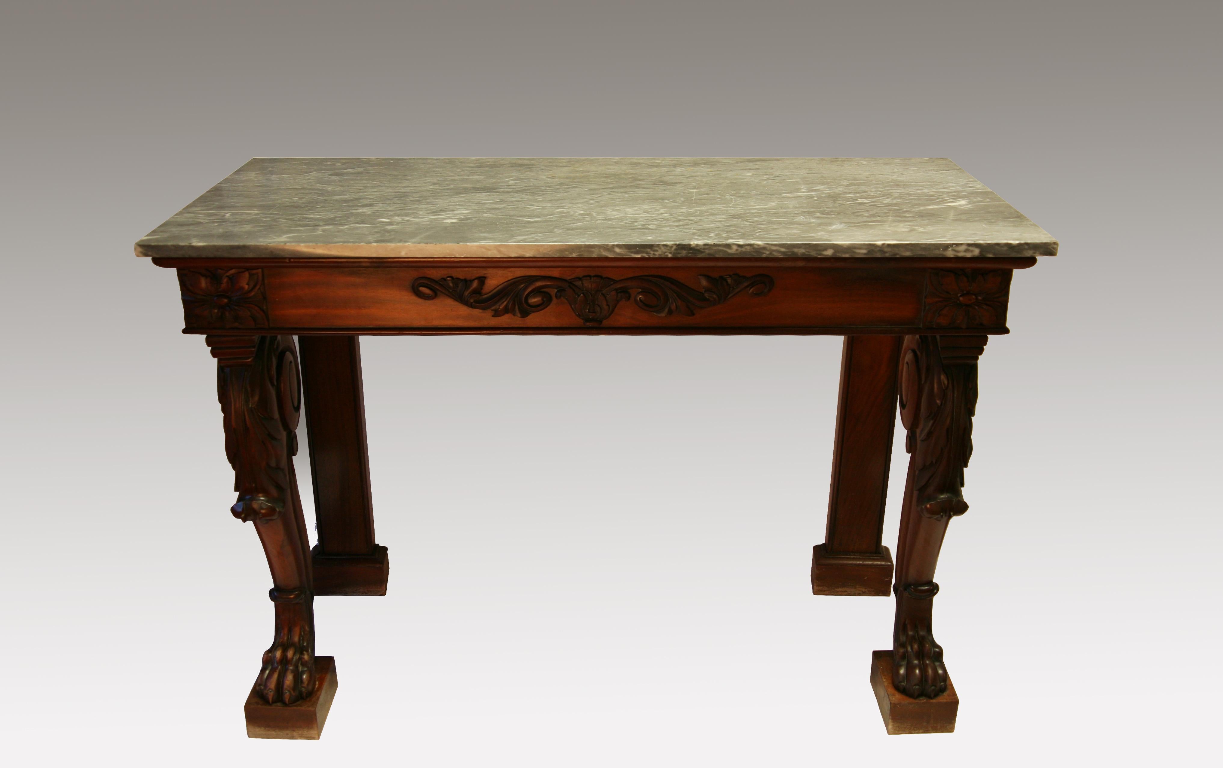 This table is supported upon four legs, the front legs beautifully carved and shaped in cabriole form and terminating in lion paw feet. Supporting the marble top is a frieze with carved frontage. It is of shallow proportions.

Measurements:
Depth