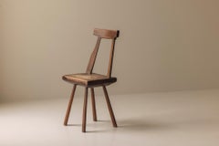 Early 19th century sculptural French side chair in solid oak.