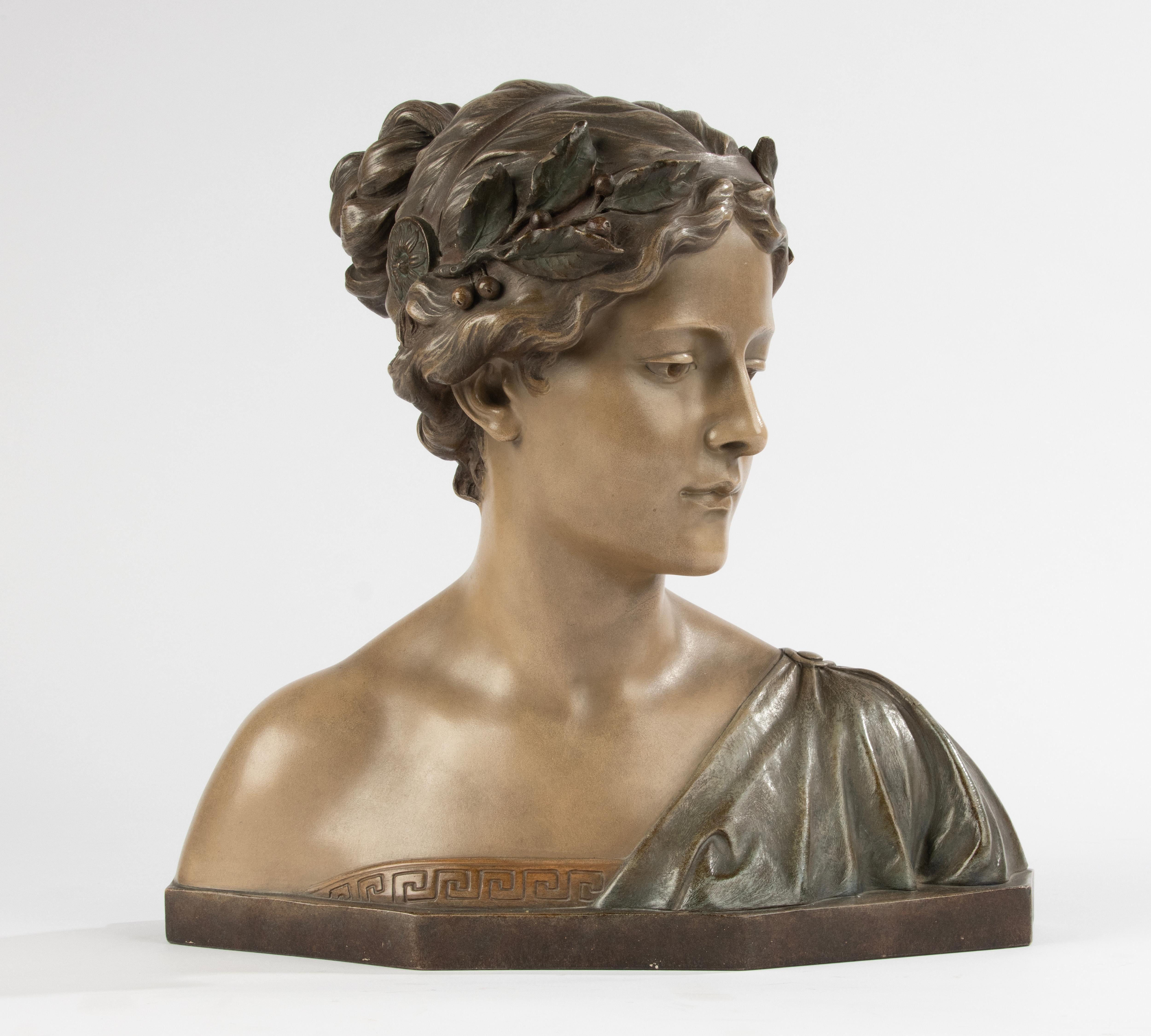 A beautiful antique bust of an ancient Greek lady.
The sculpture is made of white clay, beautifully worked with a polychrome finish.
The bust is made by the German maker Reps & Trinte Gesetzl and the stamp on the back shows that it dates from