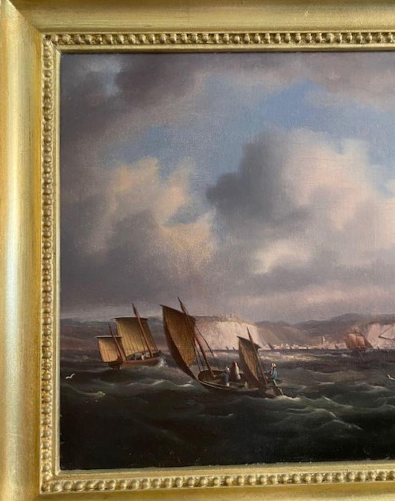 Early 19th Century Seascape by Thomas Buttersworth (English: 1768 - 1842), circa 1820, an oil on canvas view of a ship, brig and small craft in the English Channel off the Cliffs of Dover, signed lower right. Brilliant crisp detail and expressive