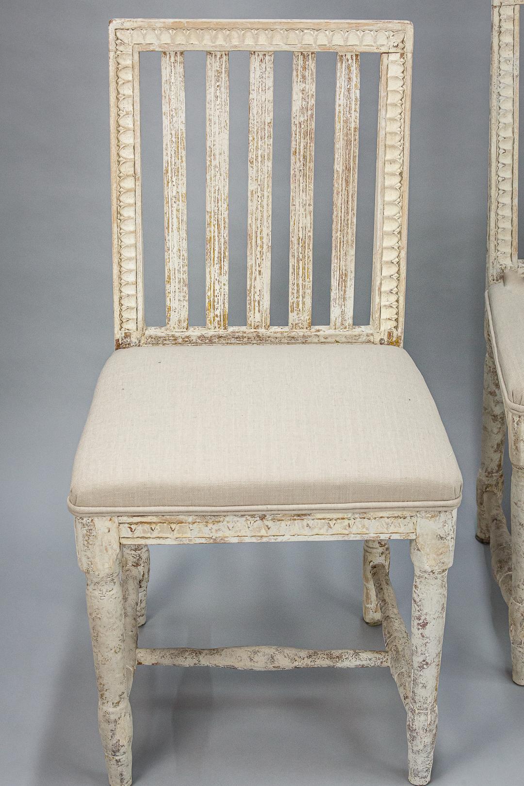 Wonderful set of 6 Provincial Swedish dining chairs, painstakingly dry scraped back to the original paint and gesso surface. newly upholstered. All carved to the underside 