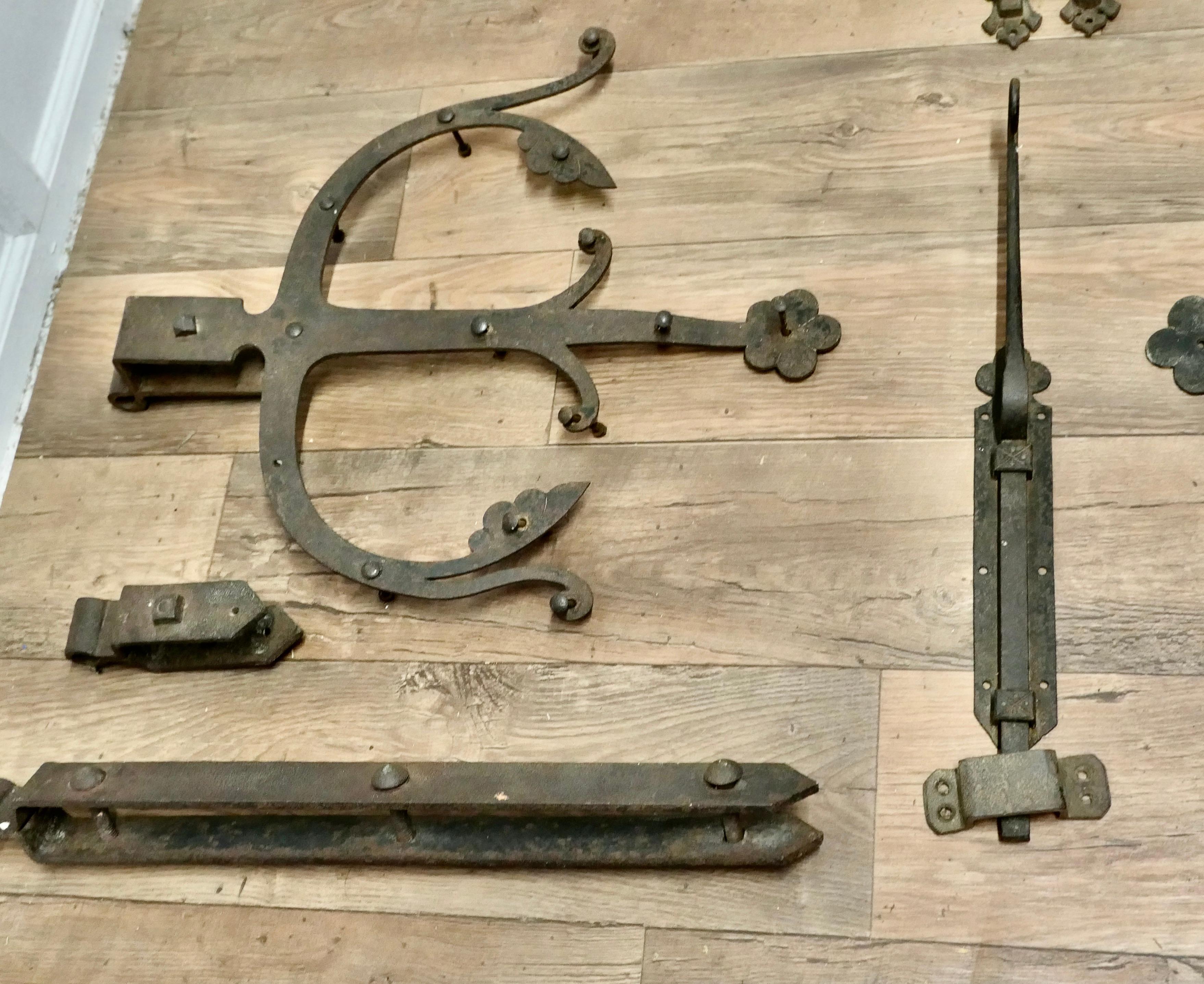 Early 19th Century Set of Double Castle Door Hinges

A rare find, this set of hinges are blacksmith made in solid iron, they are very heavy and beautifully decorative, there is also an end bolt lock and a central latch
The hinges will fit around a