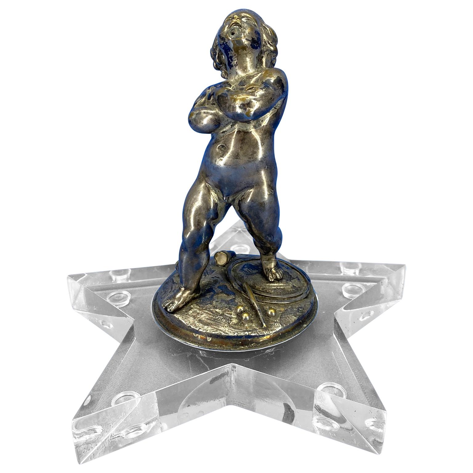 Early 19th Century silver plated putti on a modern star shaped Lucite base.