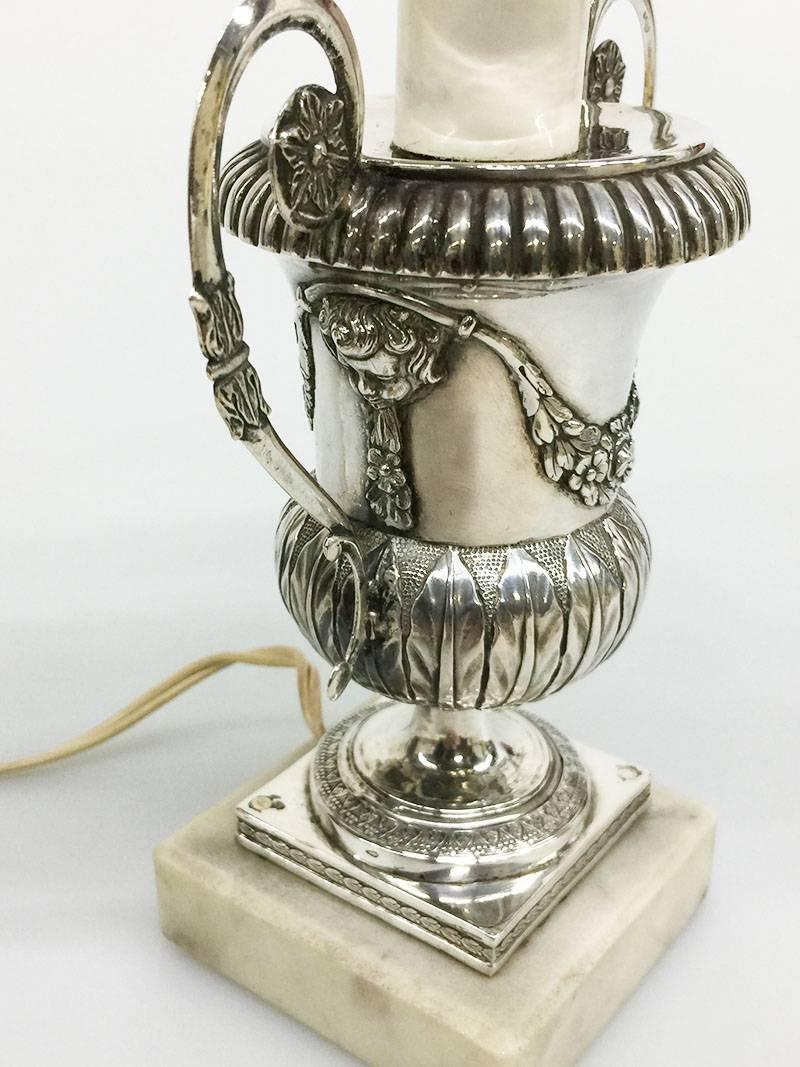 19th Century small Silver Belgian table lamp, 1814-1831

Early 19th century silver Belgian candleholder changed into a lamp
Belgian silver hall marked This hall mark is used during 14-09-1814 / 18-08-1831,  for small objects
Including made by