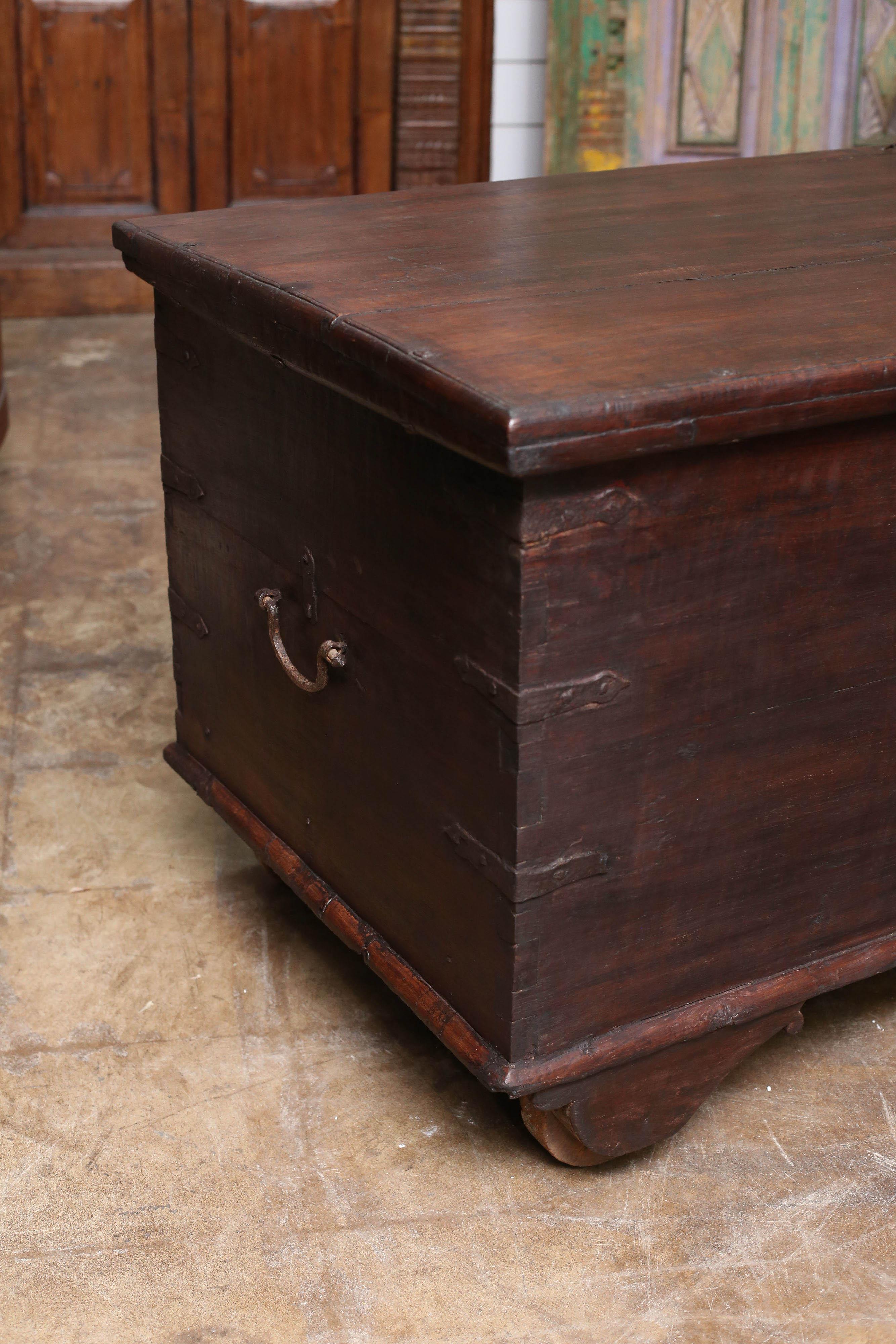This 1810s solid teak wood superbly crafted dowry chest comes from the holy town of Varanasi in central India. Consistent with the times it was made the box is fitted with wooden wheels. This investment quality chest has stood the test of times.