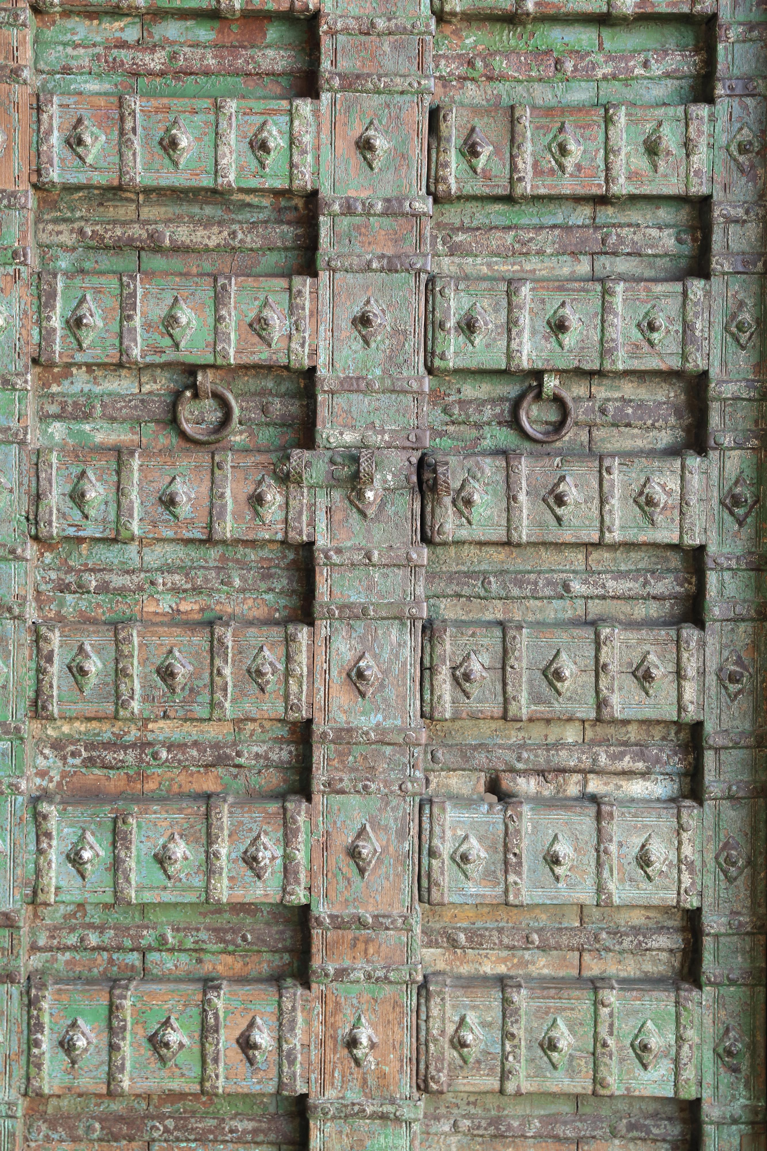 Anglo Raj Early 19th Century Solid Teak Wood Highly Carved Entry Doors of a Village Temple For Sale