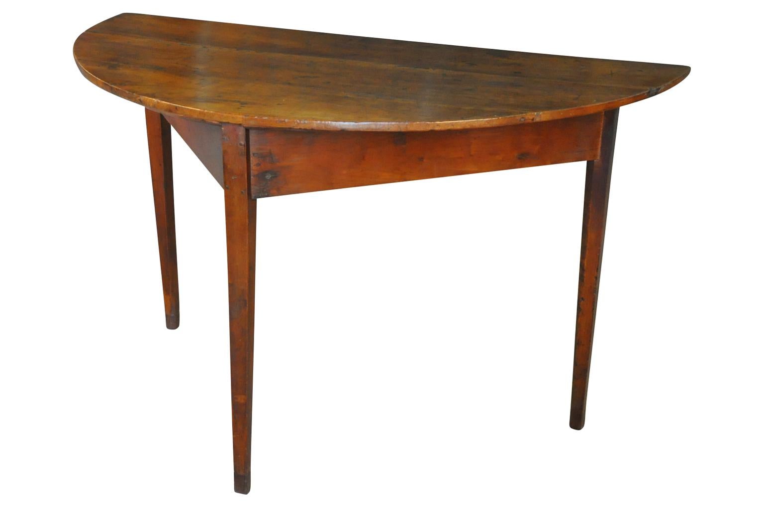 A very handsome early 19th century demilune table from Spain. Beautifully constructed with very Minimalist lines from walnut. Super patina.