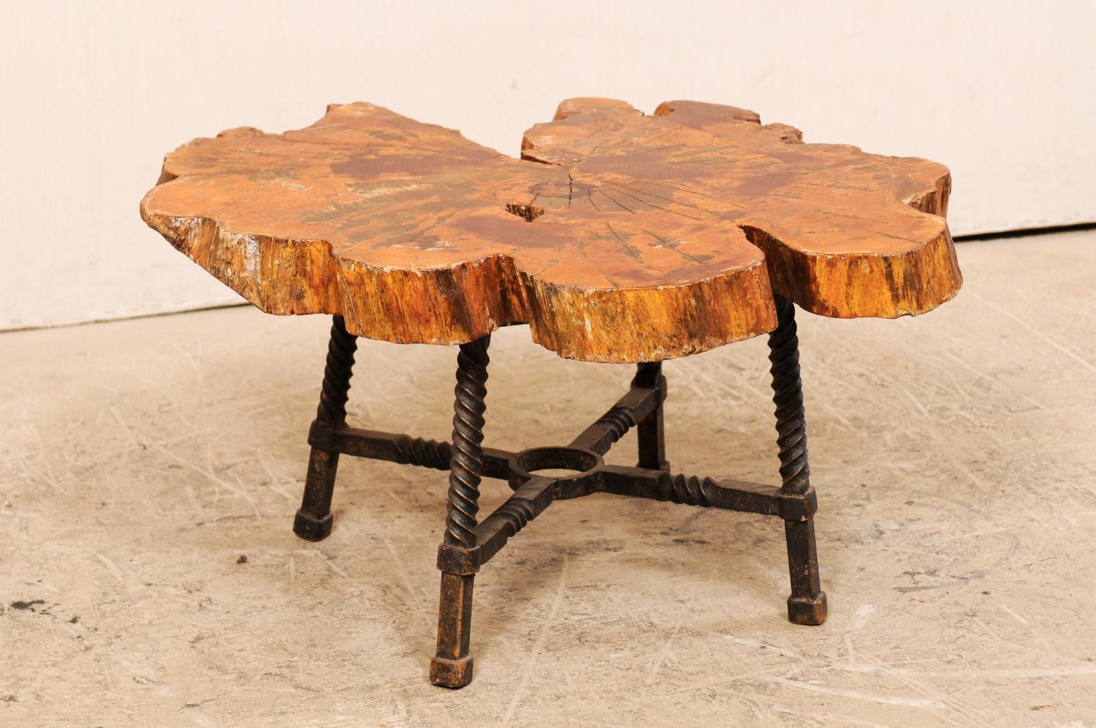 Early 19th Century Spanish Wood Slab Coffee Table with Hand Forged Iron Base In Good Condition In Atlanta, GA