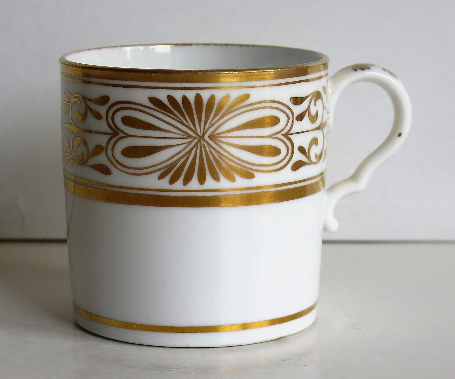 This is a fine example of an English George III period, porcelain, coffee can (cup), made by Spode in the early 19th century, circa 1810.

The can is nominally straight sided and has the Spode loop handle with a pronounced kick or kink to the