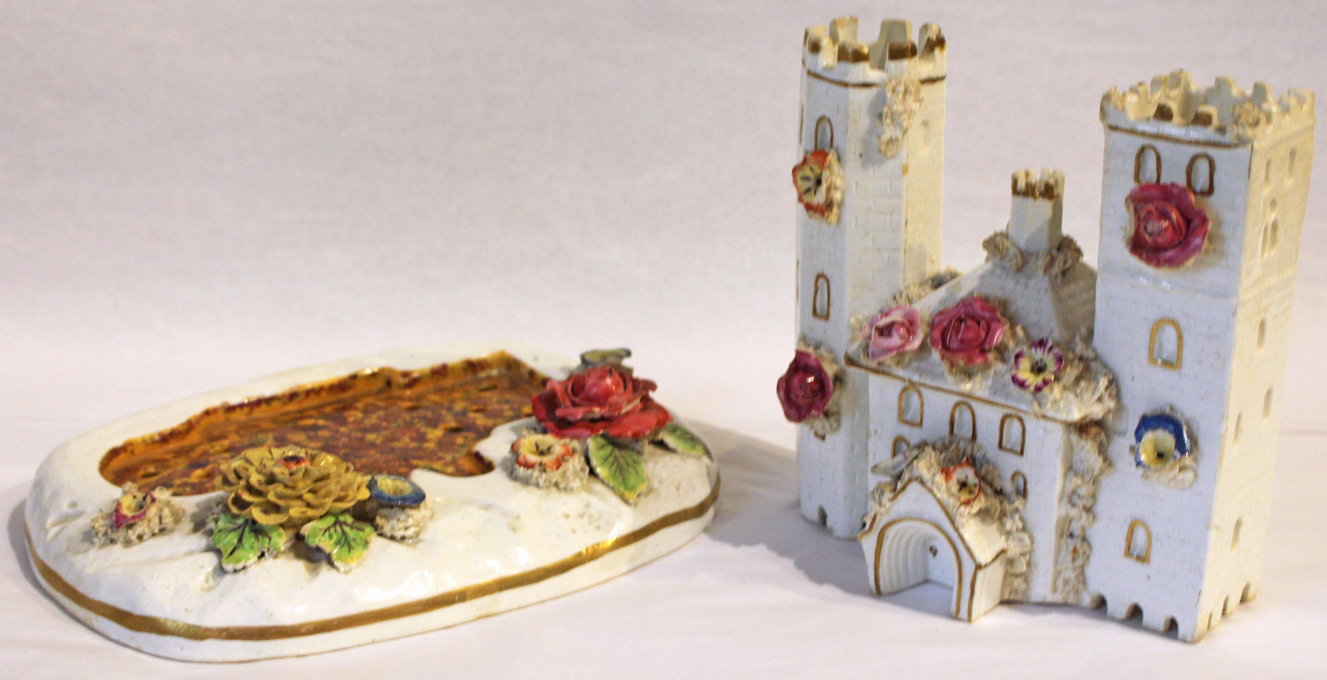 Castle pastille burner chimney ornament. Staffordshire, c. 1830-40. Made in two parts. Round & square towers. Round tower black crenelation. Repaired. Typical flower losses. Manheim, NYC. 8 1/4