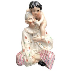 Early 19th Century Staffordshire Porcelain Figure of Boy on Woman's Shoulder
