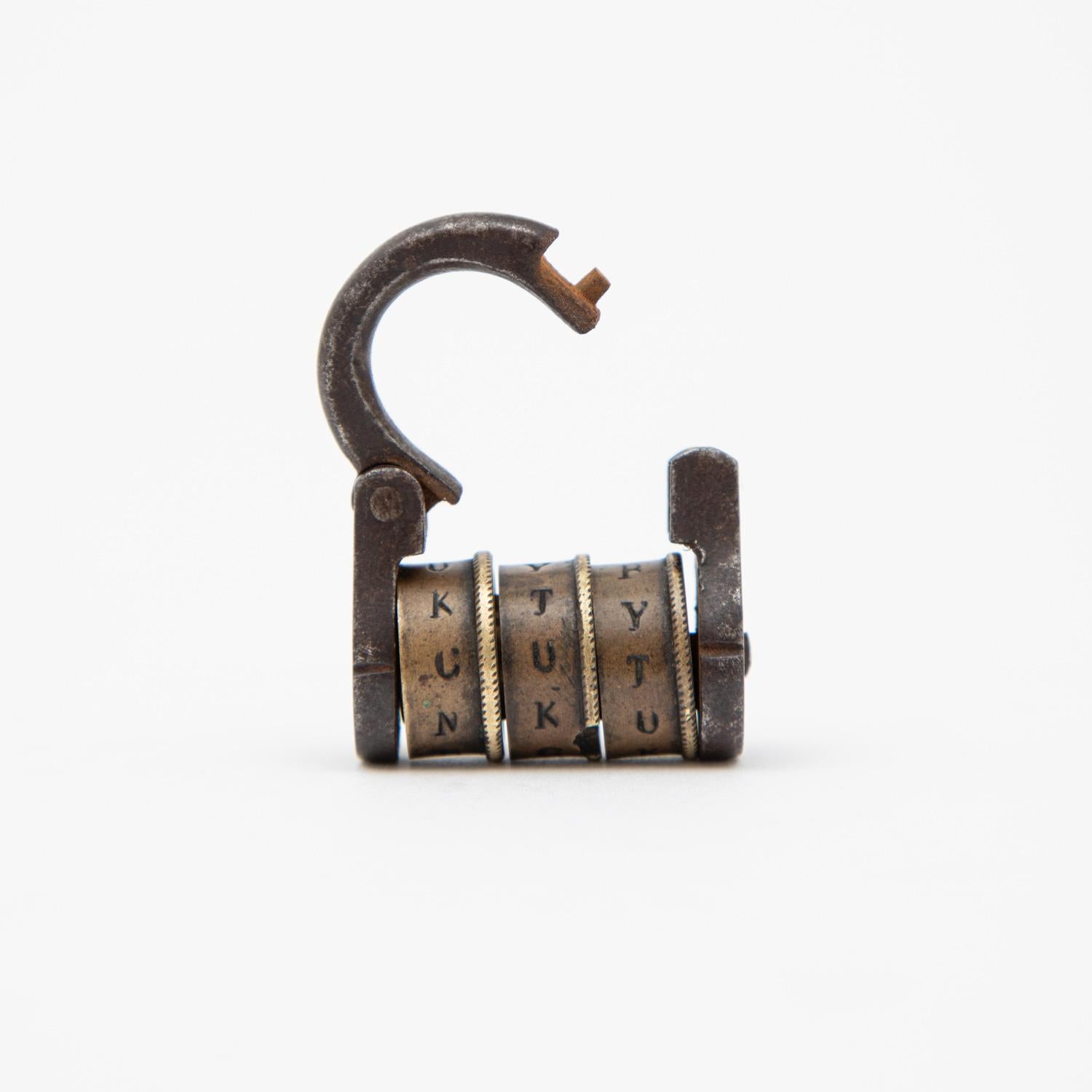 Early 19th century enchanting combination padlock.

It is in full working order, the three brass barrels spell CUT to release the steel loop.