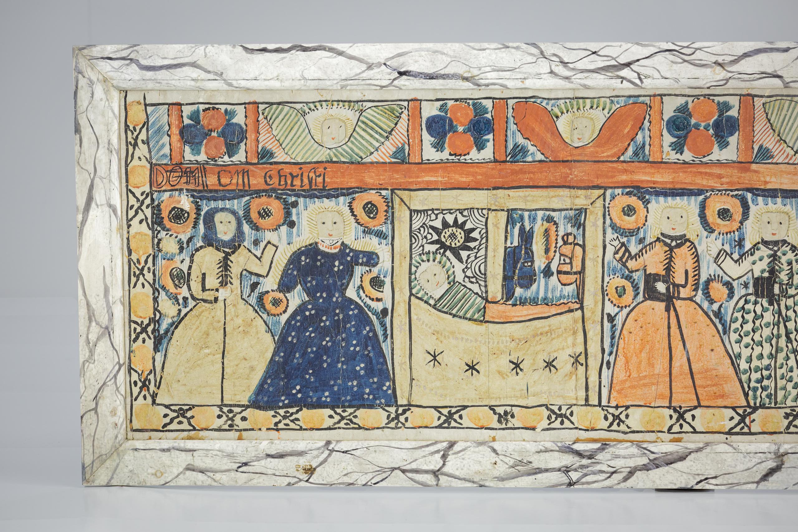 Extraordinaire Bonad suédois du 19e siècle. La Nativité, l'imagerie capturant l'enfant dans une crèche dans l'étable, surplombé par des ânes et des anges. Coloris primitif et exubérant. Encadré dans un cadre en faux marbre peint à la main Circa