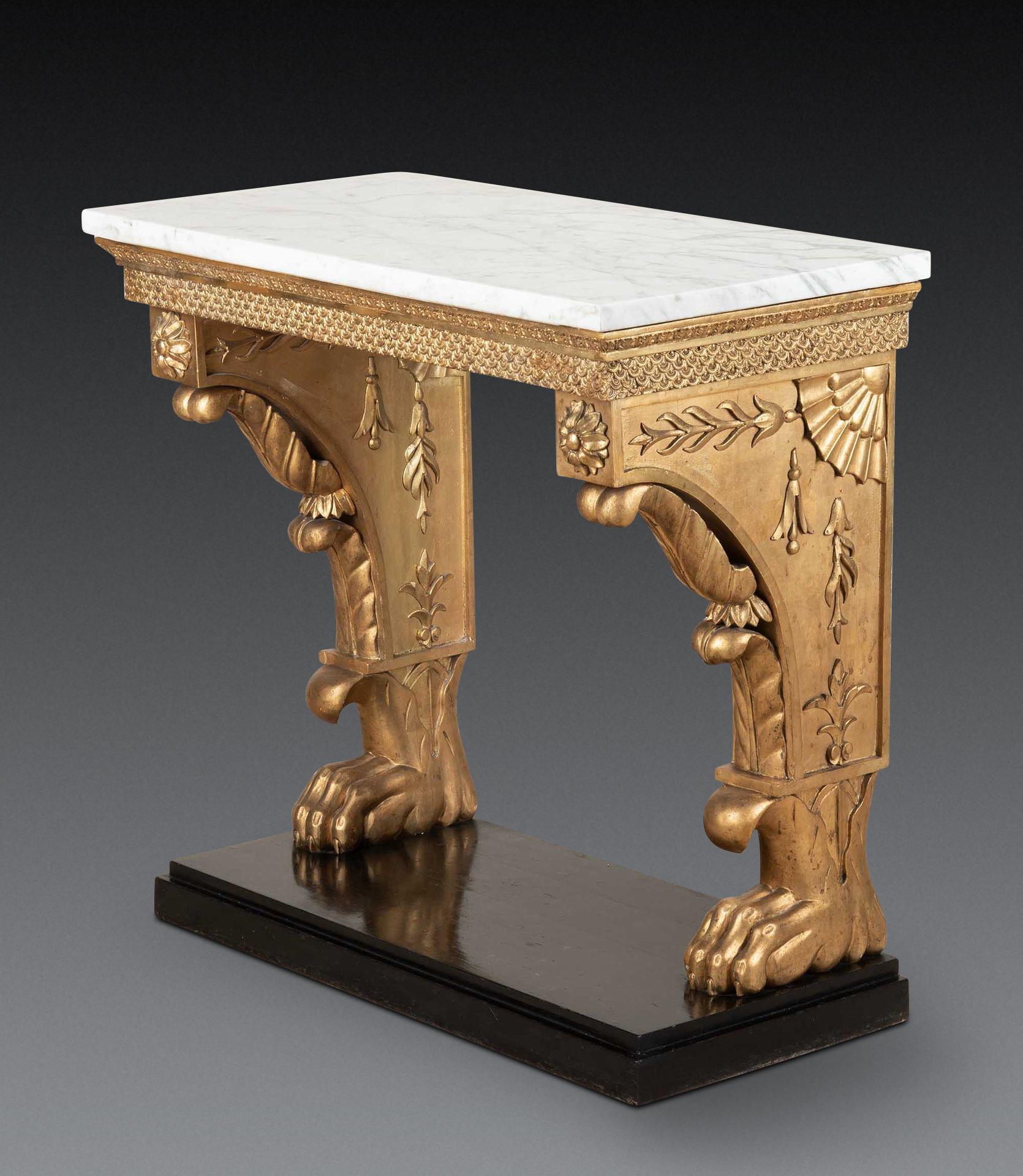  A stylish Early C19th Swedish console table, the original Carrara marble top above a giltwood base with carved acanthus and fish scale frieze, raised twin monopodium supports with central rosettes and scroll corbels with decorative carvings to the