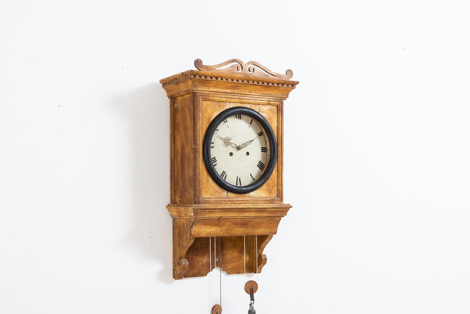 Folk Art wall clock made during the first half of the 19th century. The clock is in untouched condition and with original paint. The mechanism is the same as it is in classic mora clocks. From northern Sweden.