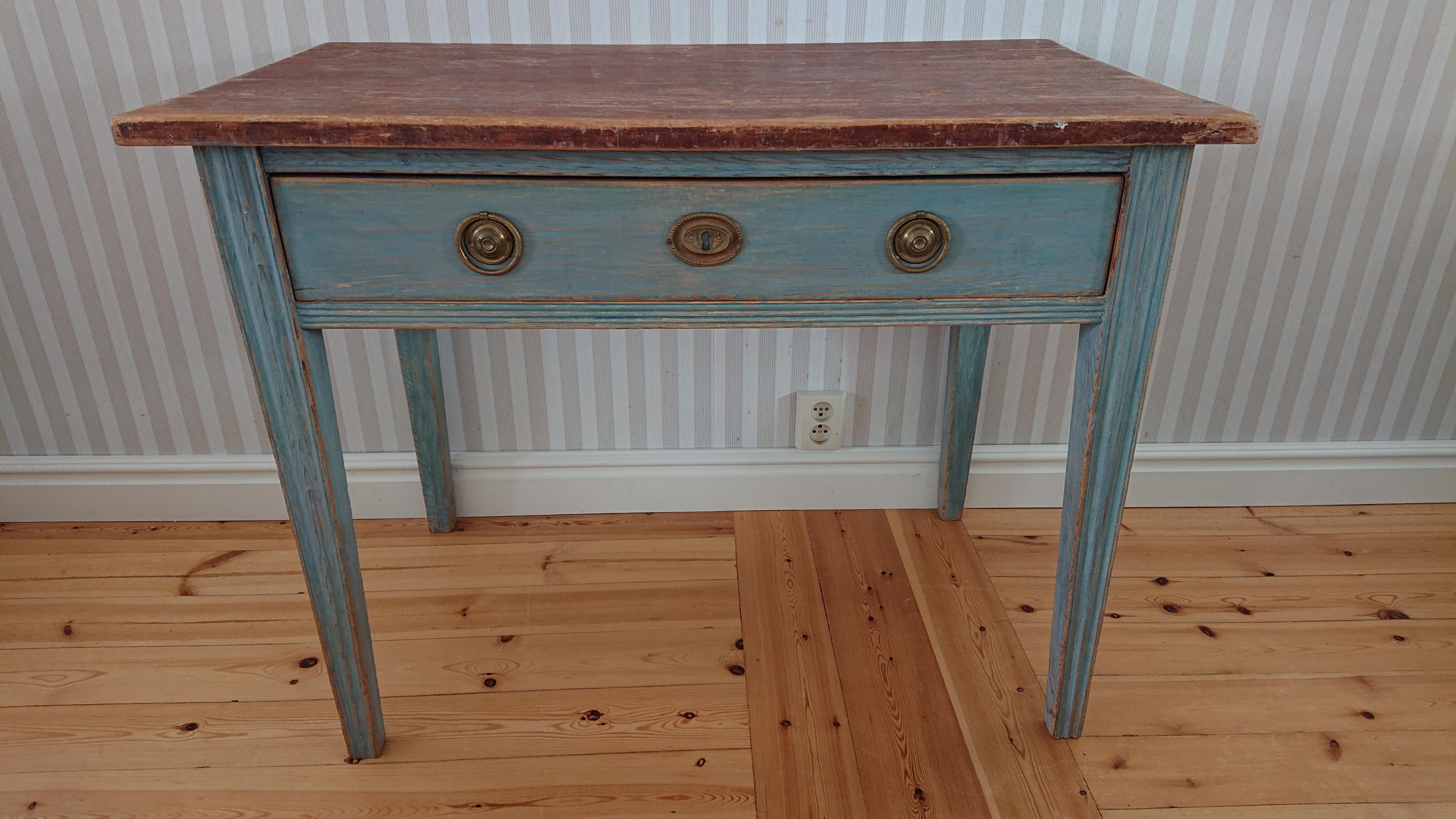 Early 19th century Swedish Gustavian  antique rustic desk from Umeå Västerbotten, Northern Sweden.
Nice Gustavian Desk Scraped by hand to its original paint.
The table has lovely blue color & stunning patina.
The table has reeded legs and reeded at
