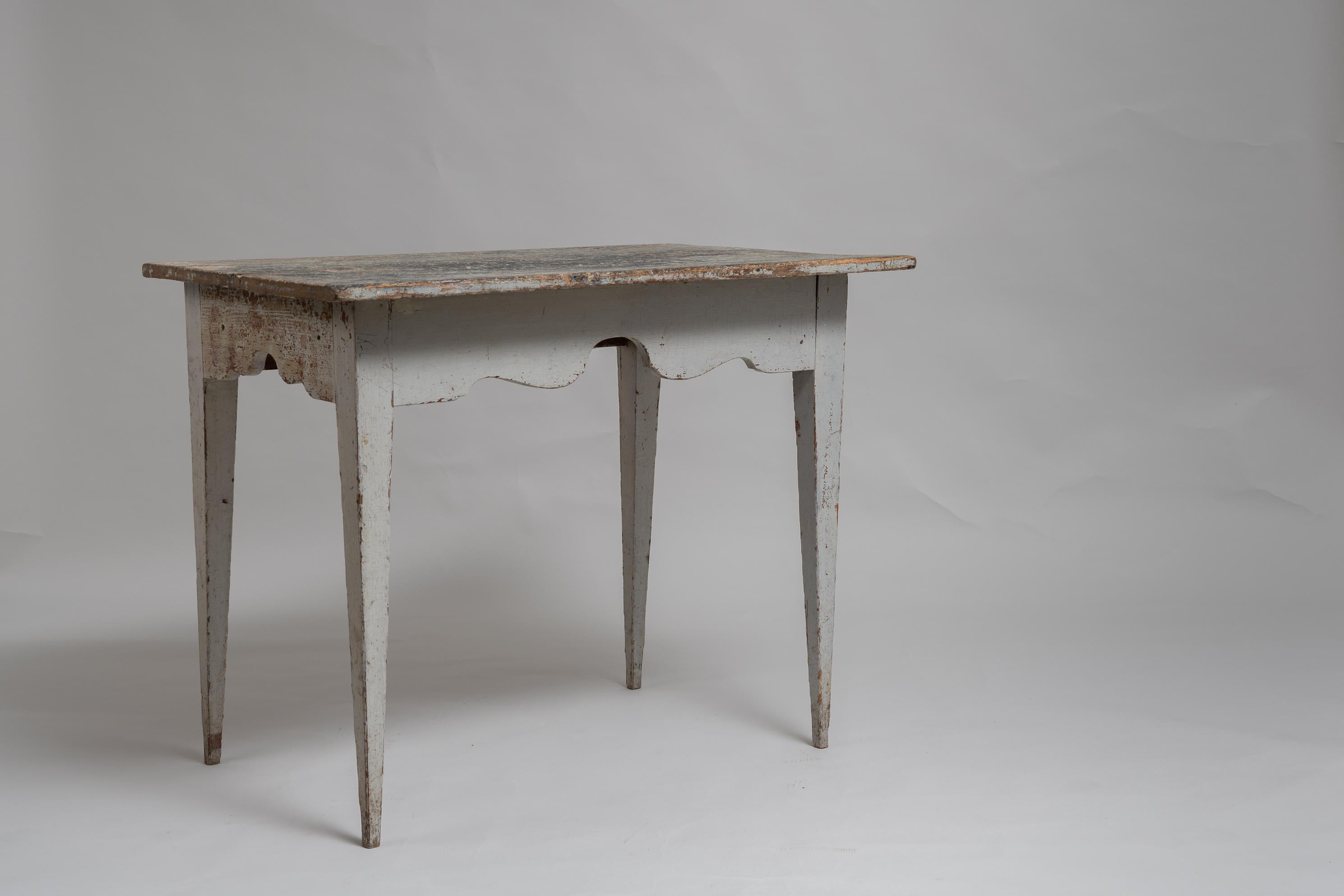 Swedish country wall table or console table in gustavian style from Northern Sweden. Made around 1810 to 1820 in painted pine. Unusual profiled edge on the front and short sides. The table also has traces of 19th century graffiti on the table top,