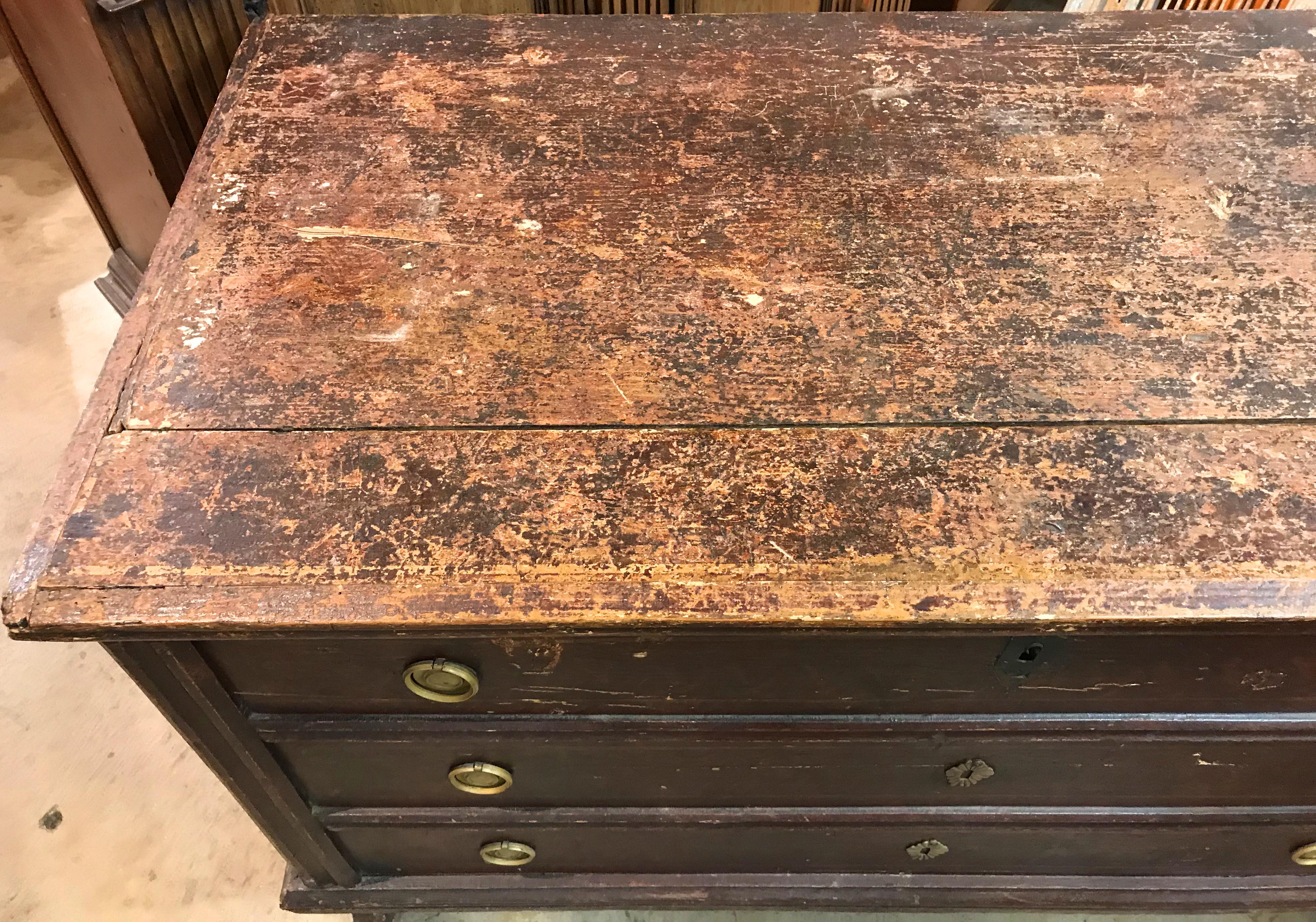 A rustic early 19th century Swedish footed lift top blanket chest with three faux drawer fronts, interior till, and wrought iron carrying handles. Good overall condition, with heavy top wear and paint losses, shrinkage, imperfections, and expected