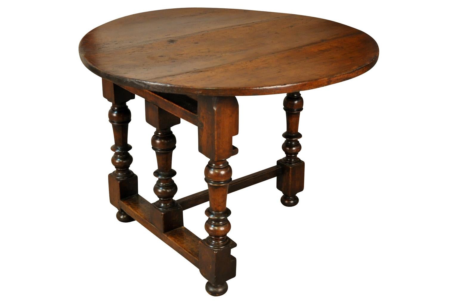 A very refined early 19th century wine tasting table - Table De Vigneron. Beautifully constructed from rich walnut with a very unique design. Gorgeous patina.