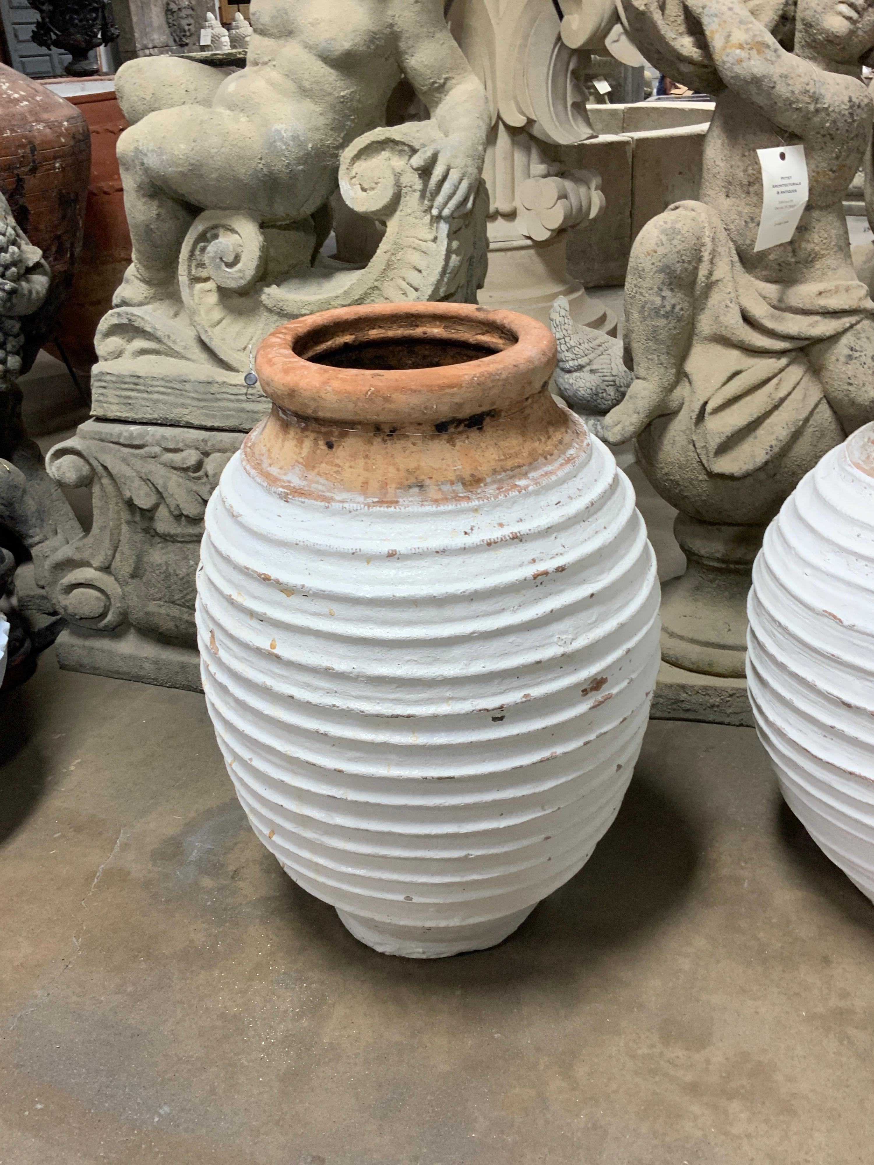 This beautiful urn originates from Greece. Item features ribbed design all around. Circa 1820s.