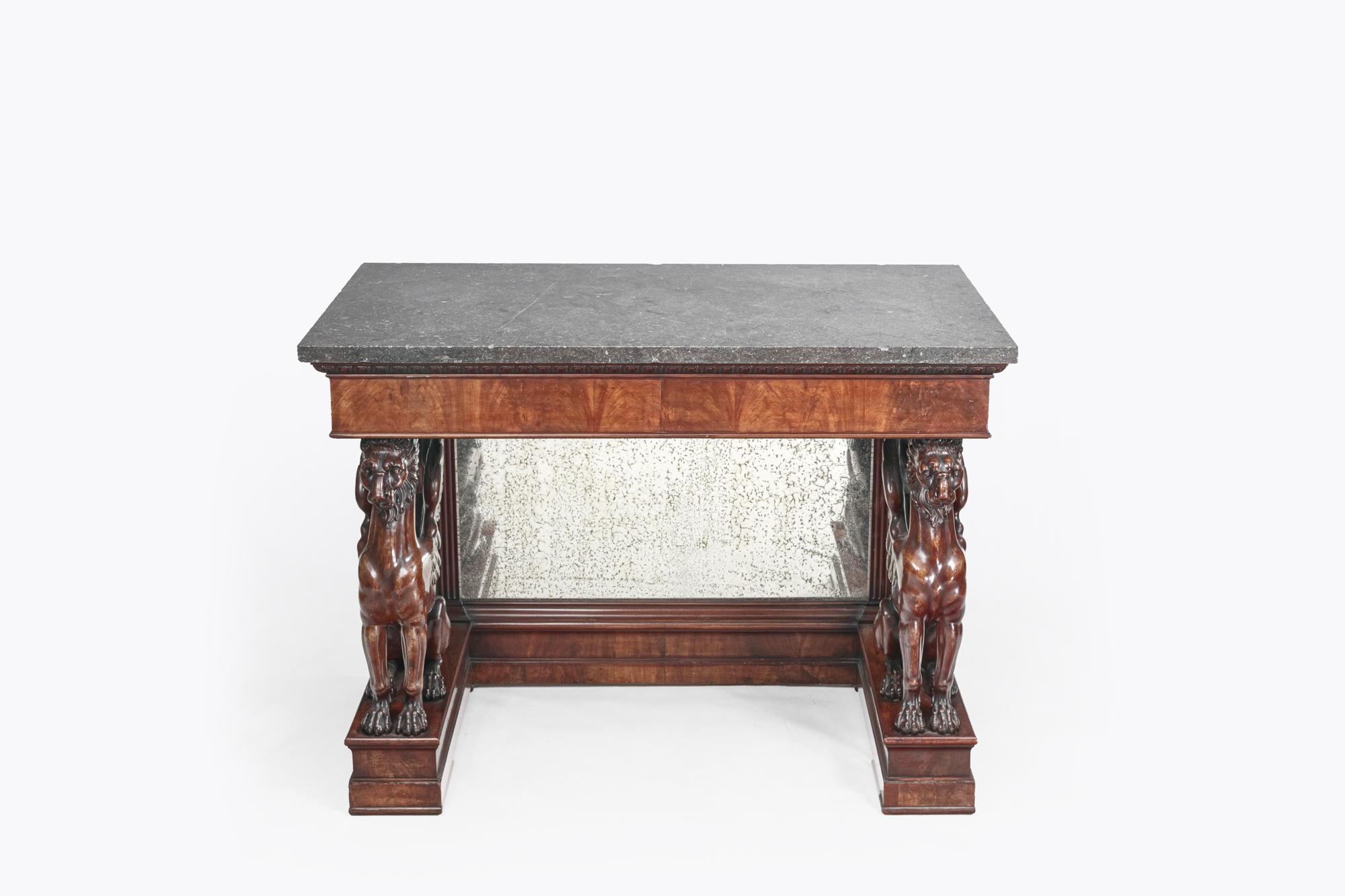 Early 19th Century Thomas Hope mahogany console table. The table features a marble top rested on mirror-backed base with two carved griffins.