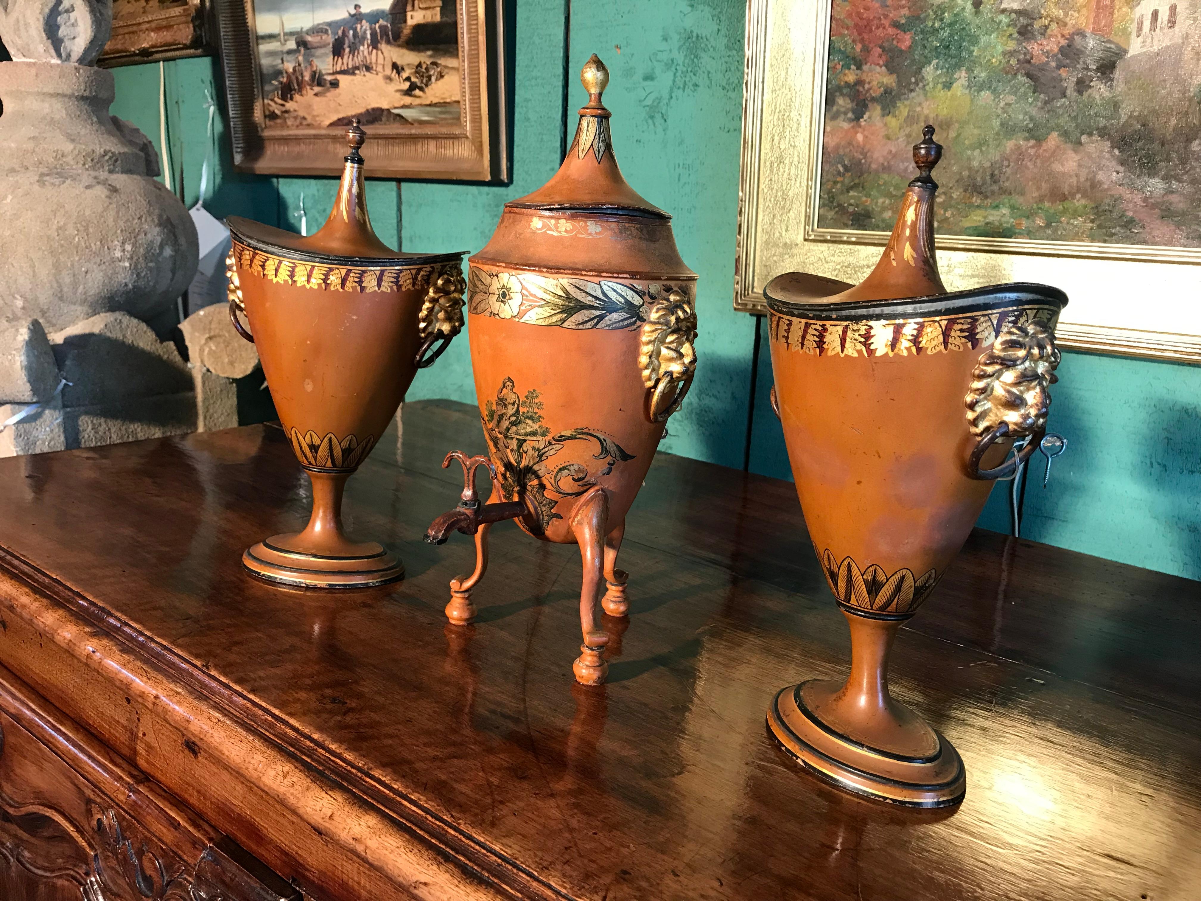 19th Century English Regency 3 Garniture Chestnut Urns tole Tea Urn Los Angeles. Early 1800’s Garniture of 3 pieces. A pair of Regency period painted and parcel gilt chestnut urns, with a tea urn on a tripod stand . Tole pewter chestnut urns vase