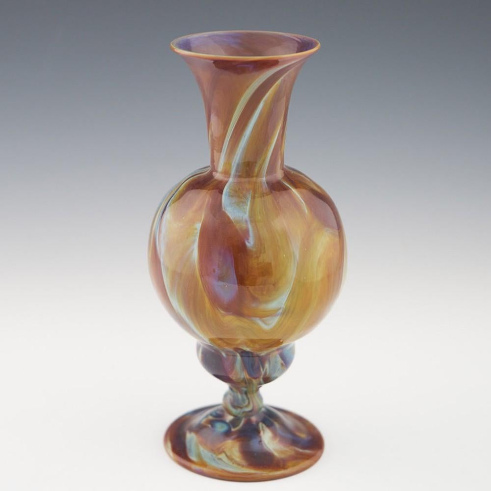Heading : 18th or 19th century Venetian Calcedonio vase
Date : Early 19th century
Origin : Venice
Bowl Features : Marbled glass with flared rim and bulbous body and a double ogee base and a ball cushion knop.
Type : Lead free
Size : 26.1cm height,