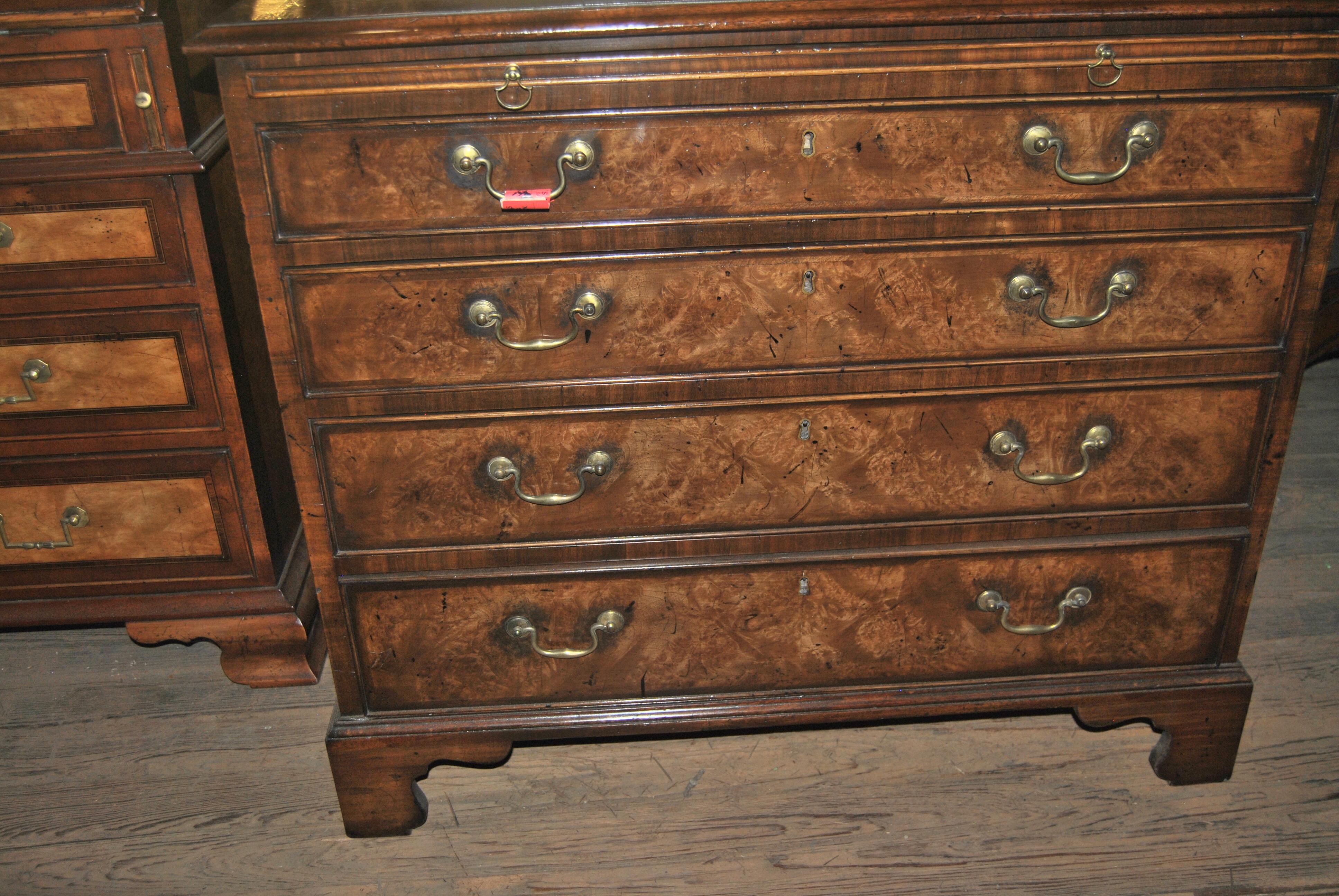 This is a walnut and Kashmir walnut chest of drawers / dresser made in England, circa, 1825. The top and both right and left sides are banded in walnut, followed by a Herringbone walnut inlay with Kashmir walnut to the middle. Kashmir walnut is the