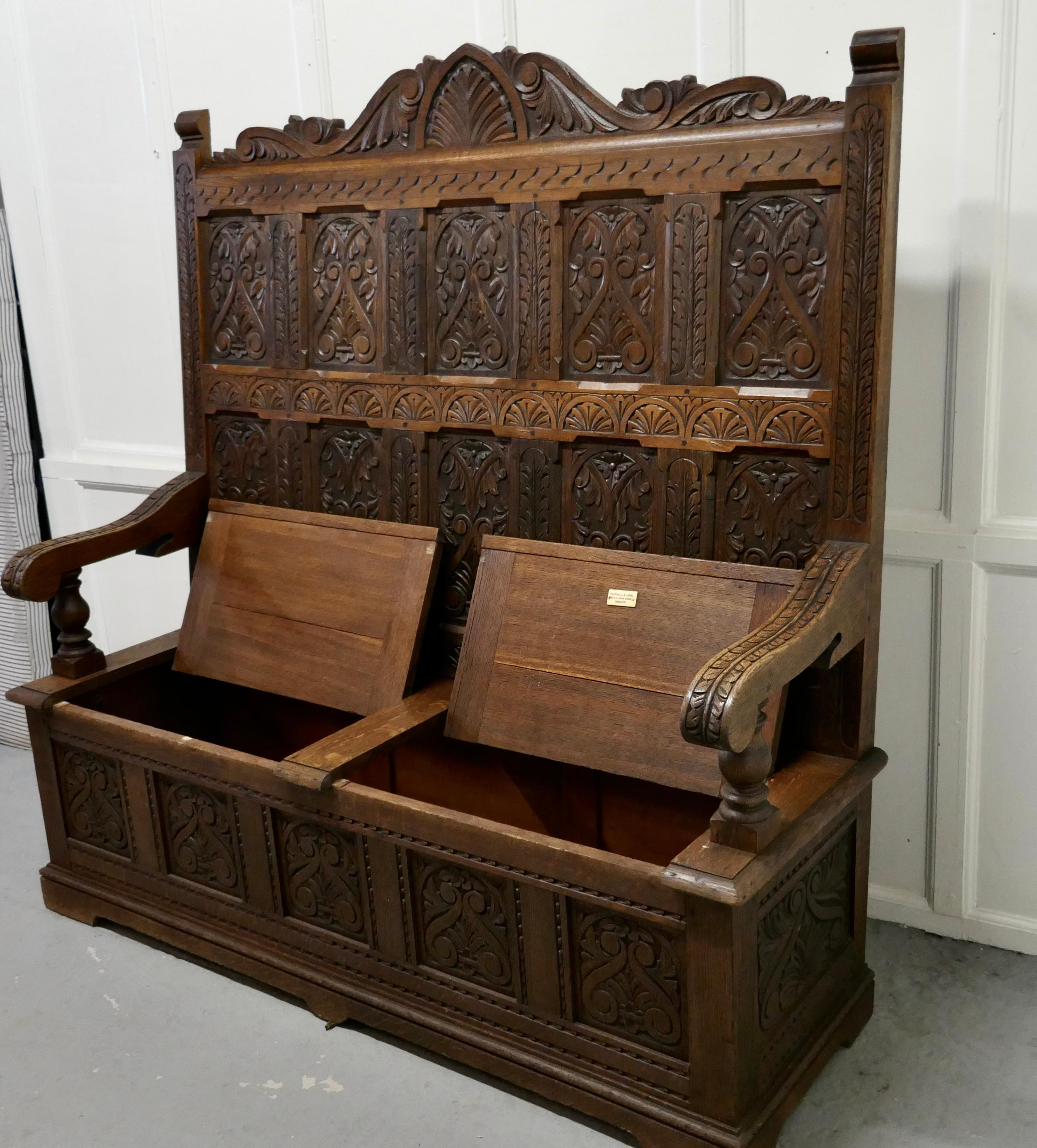 Gothic Early 19th Century Welsh High Back Carved Oak Box Settle