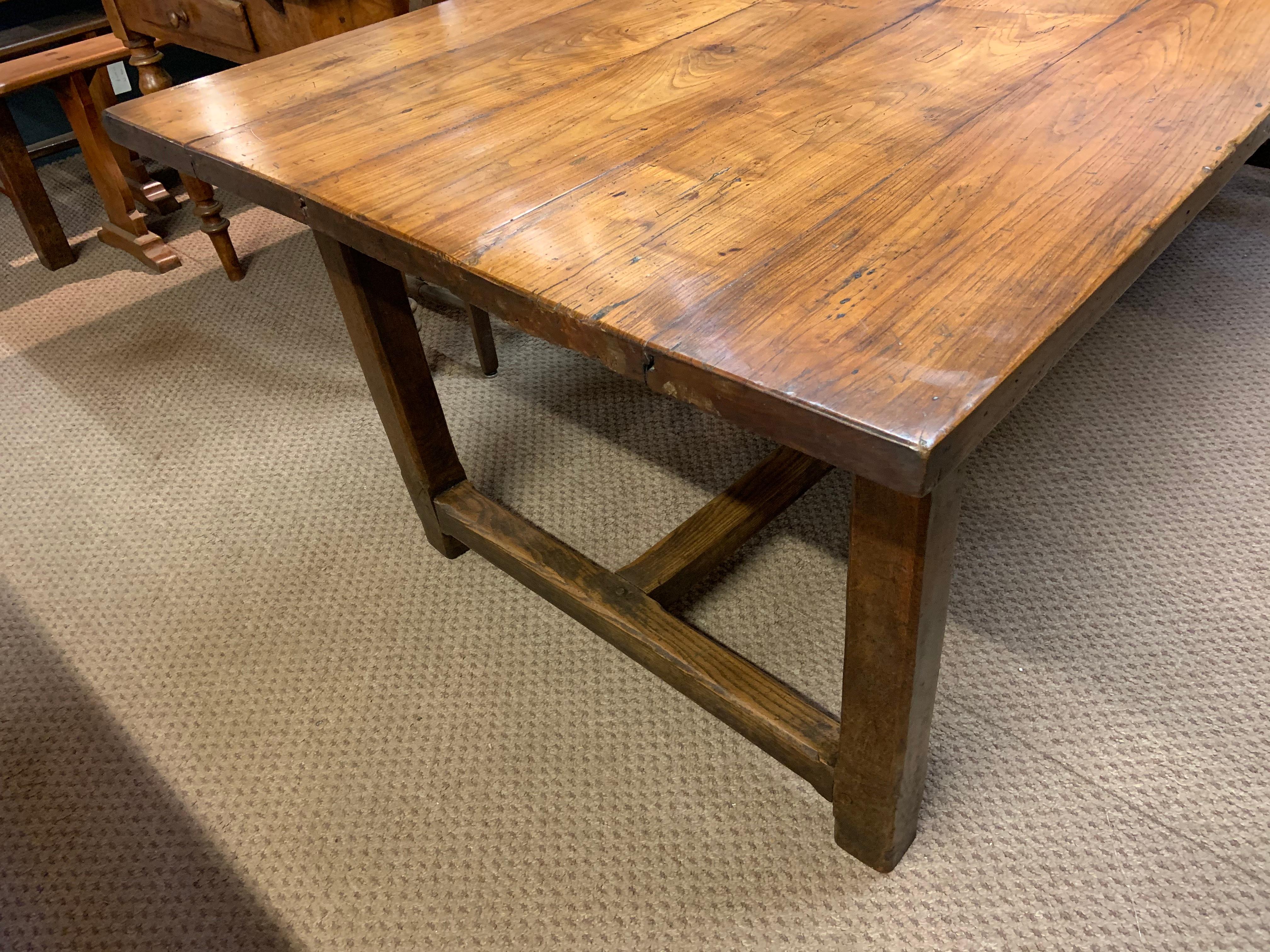 19th century cherry farmhouse table with H stretcher. Gorgeous thick wide top farmhouse table. Lovely base with wonderful patination and colour.