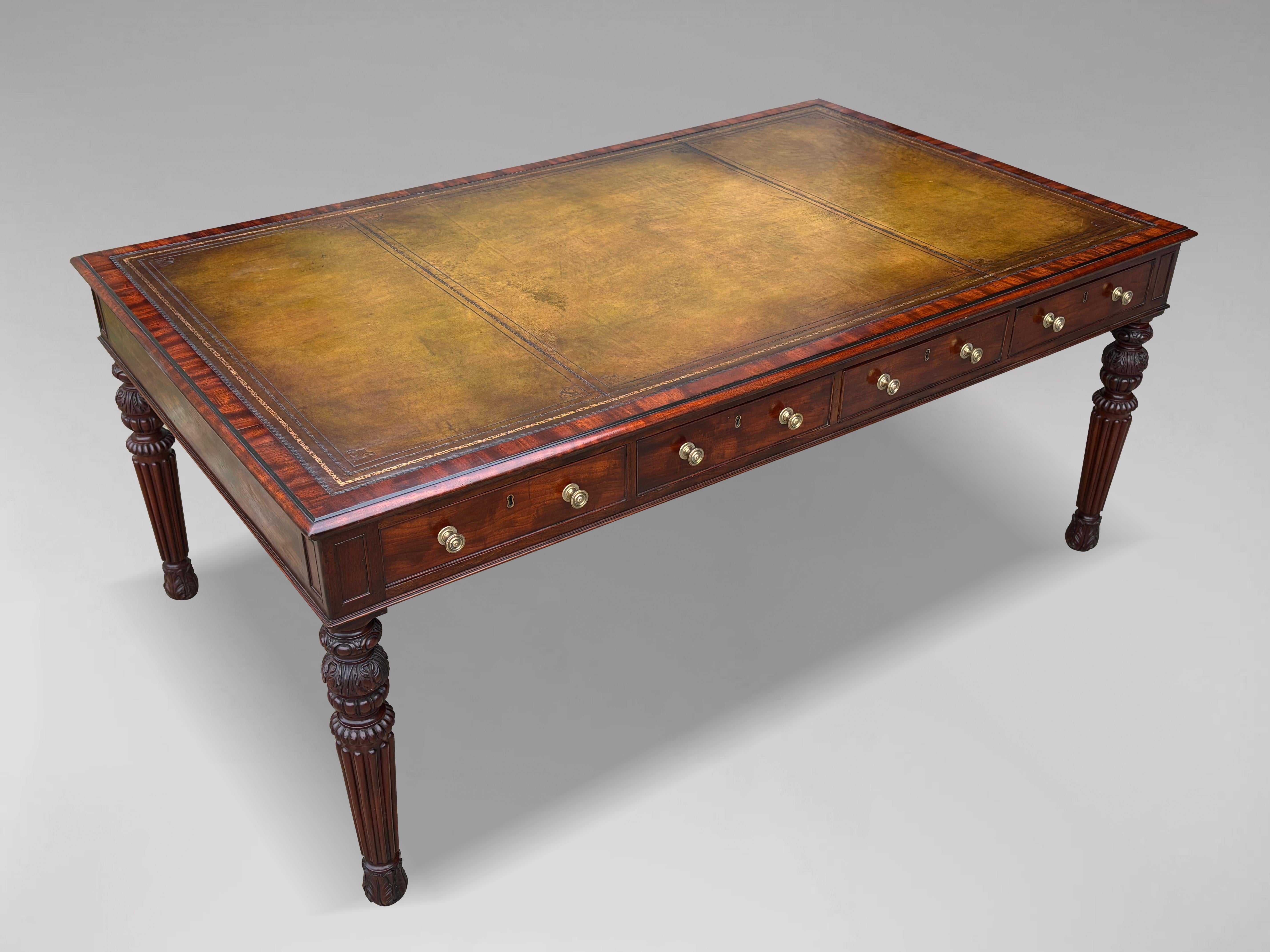An impressive and exceptional, early 19th century, William IV period mahogany partners library writing table. The moulded rectangular top with a superb quality green tooled leather inset top above 8 drawers with the original turned brass knobs,