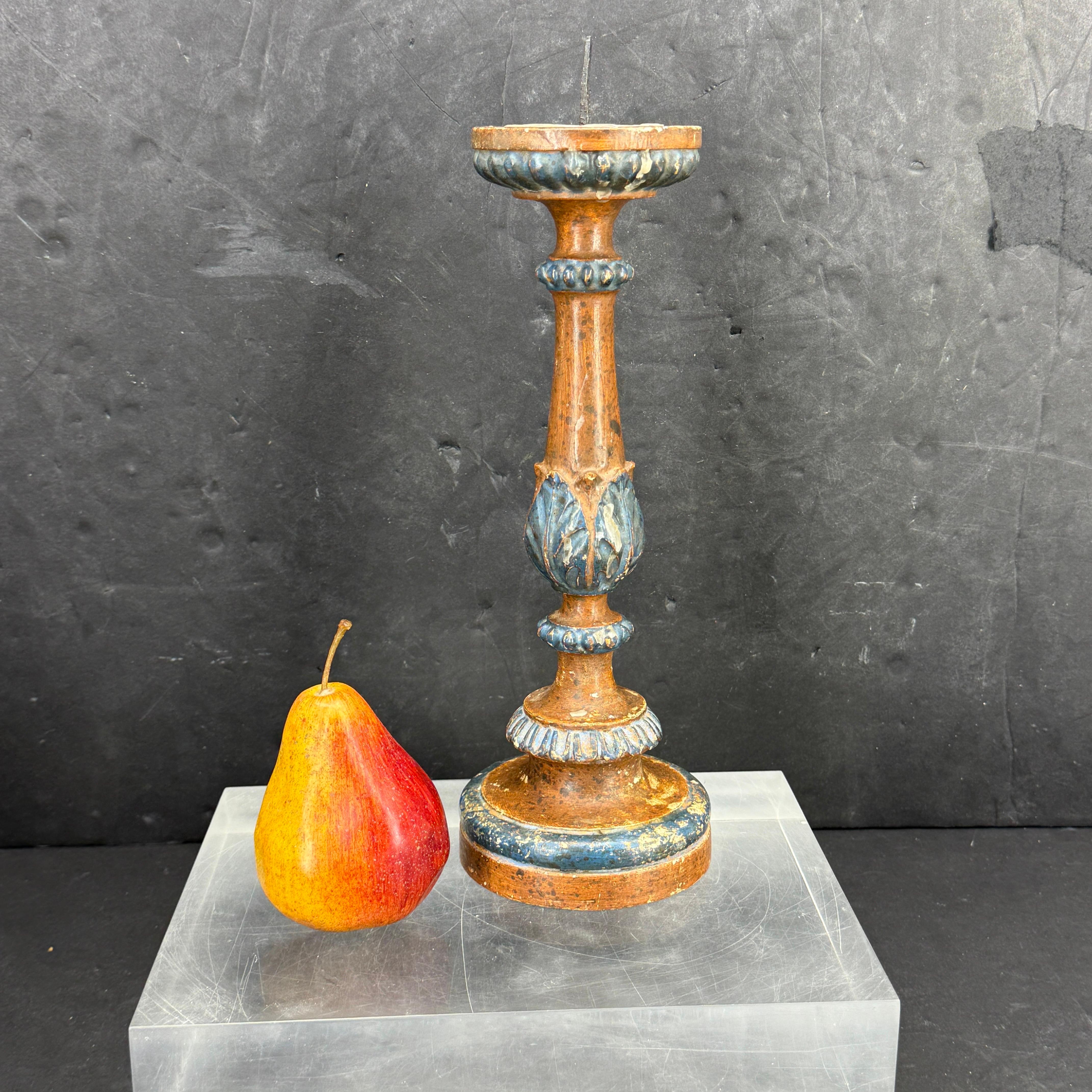 Carved wood blue painted and gold gilded alter candlestick with original colors, patina and pricket. This untouched pricket candlestick, possibly from a castle, is carved from wood and has an iron spike for displaying a pillar candle. Wonderful