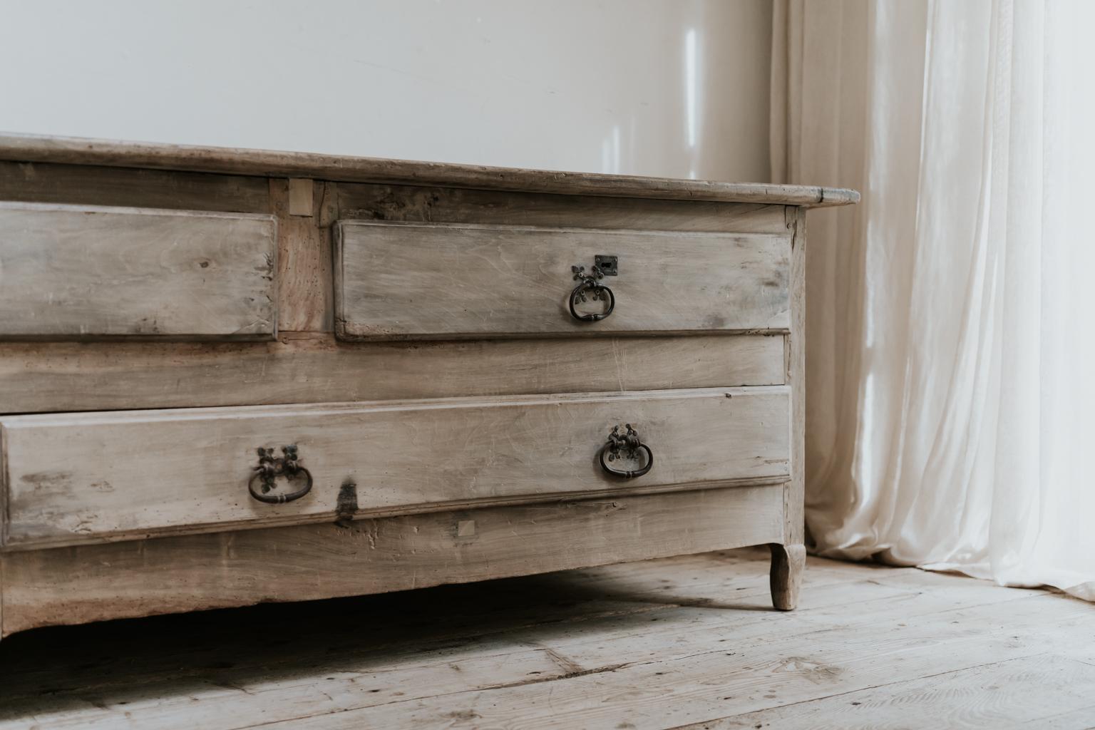 This is a unique piece, walnut and oak, very large drawers on this enfilade/bank of drawers found in the South of France, Toulouse region, made to store priests clothes in the 19th century, in the sacristie of the church, wonderful sunkissed patina