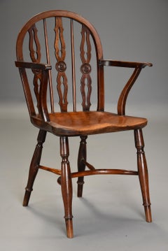 Early 19th Century Yew Wood Prior Low Hoop Back Windsor Armchair