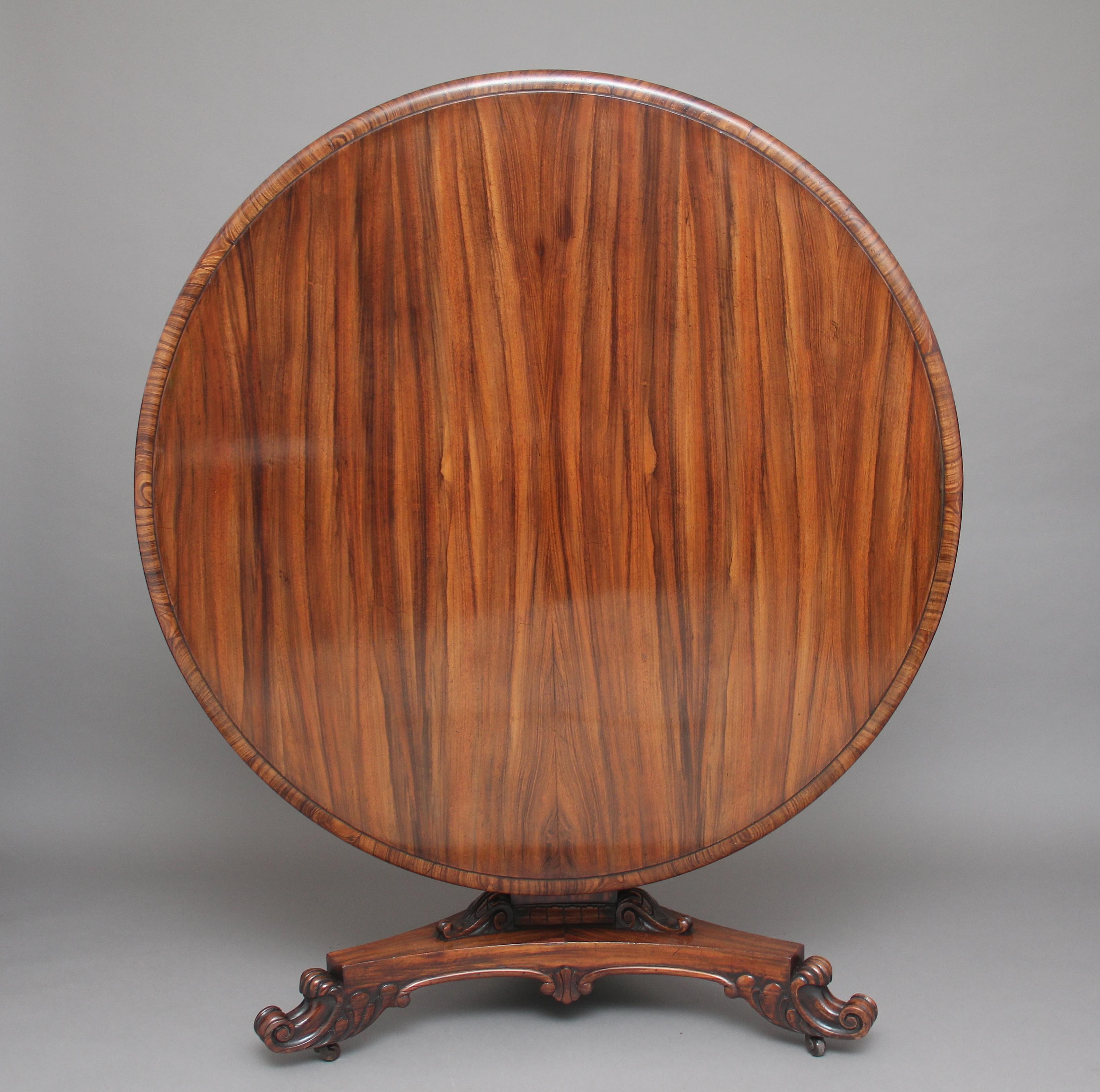 A rare early 19th century zebrawood centre table, the lovely figured and moulded edge top having a cross grained edge, supported on a tri-form column terminating with carved decoration, the tri-form platform base having carved detail and beading