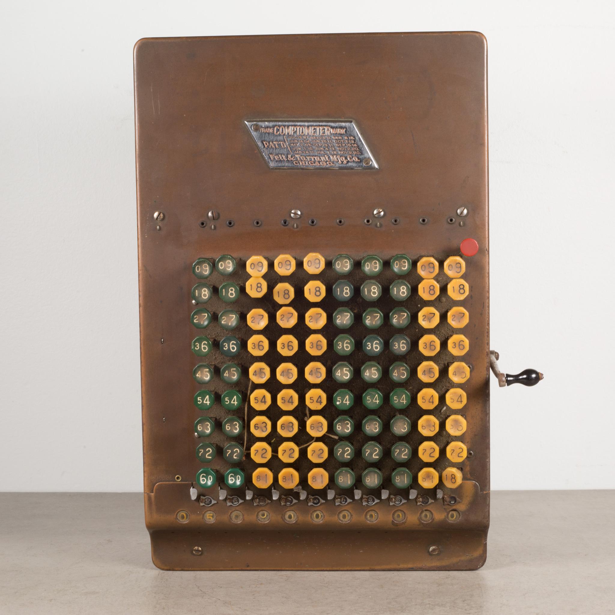 About
An antique Comptometer copper and tin adding machine with yellow and green Bakelite buttons and original metal name tag, manufactures tag and side decorations. The lever somewhat pulls working the inner mechanisms. The piece has retained its