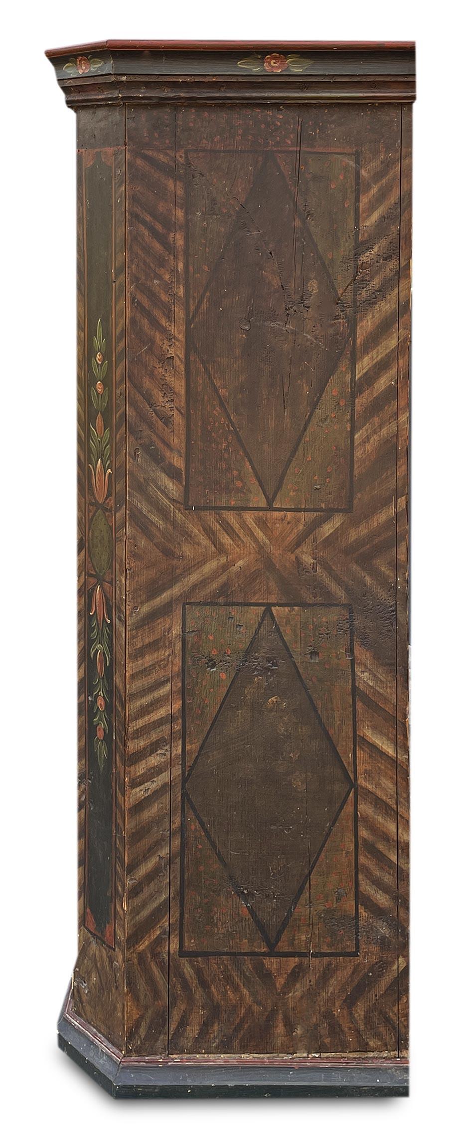 Early 19th Tyrolean Painted Cabinet

Measurements: H. 179 cm – W. 110 (122 at the frames) cm – D. 59 (67 at the frames) cm
Period: approximately 1820
Origin: Tyrol
Essence: Fir

Description of the object
Antique one-door wardrobe, with notches.
The
