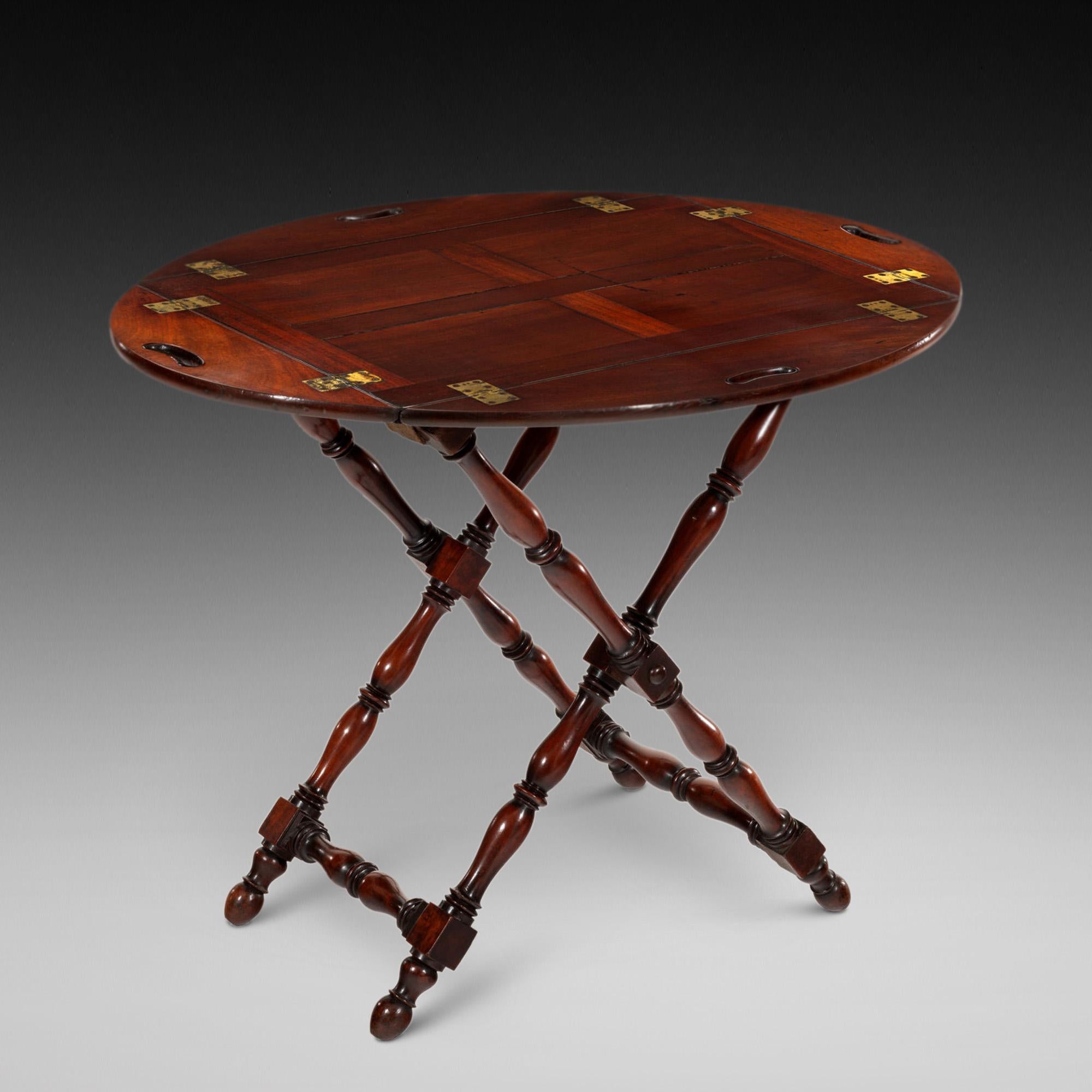 Early 19thC Mahogany Butler’s Tray the Cuban mahogany oval panelled tray fitted with brass hinged fittings on the original turned X-Frame stand - 38