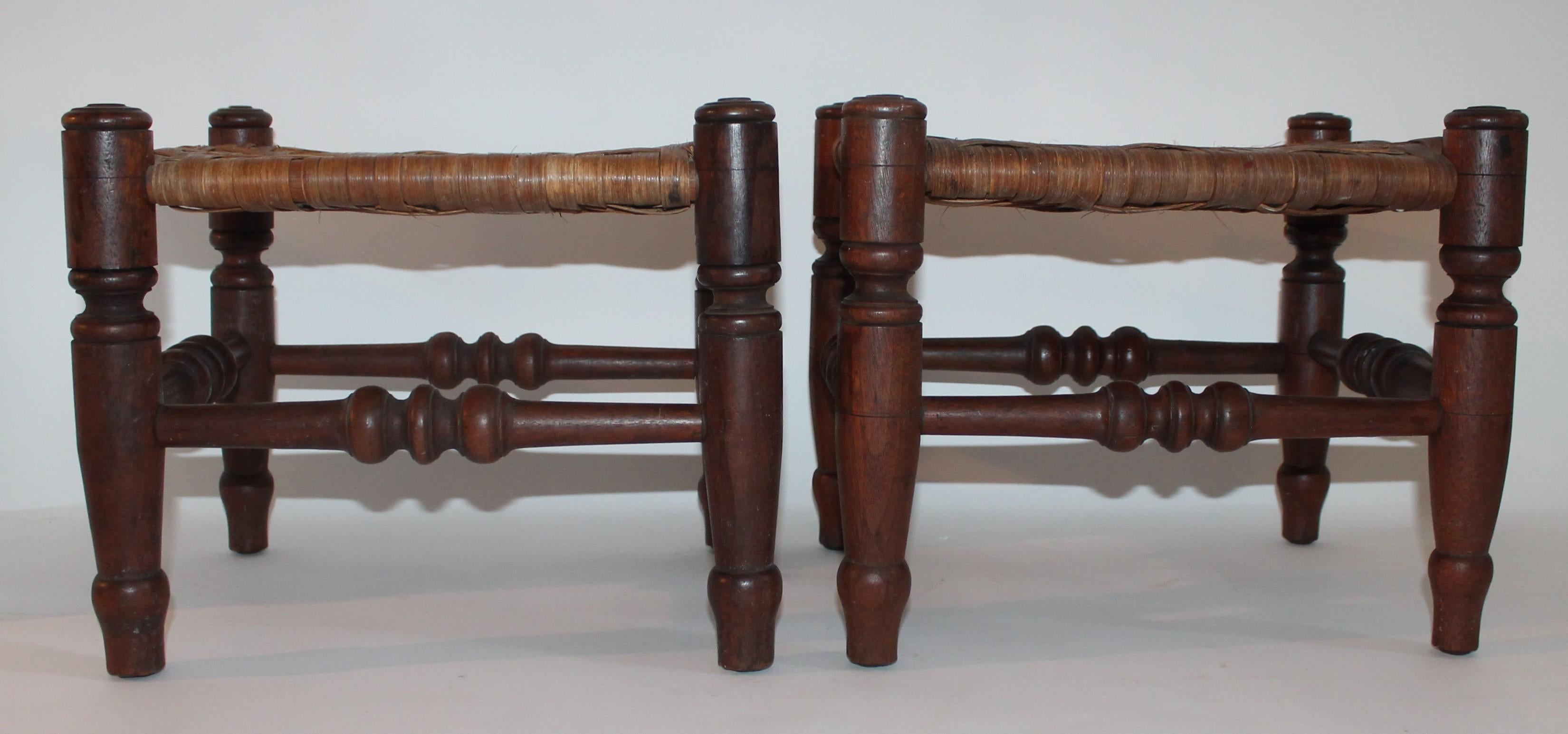These amazing and very early 19th century hand carved from Pennsylvania foot stools are in Fine condition. These early 19th century stools are in fine condition. Sold as a perfect matched pair.