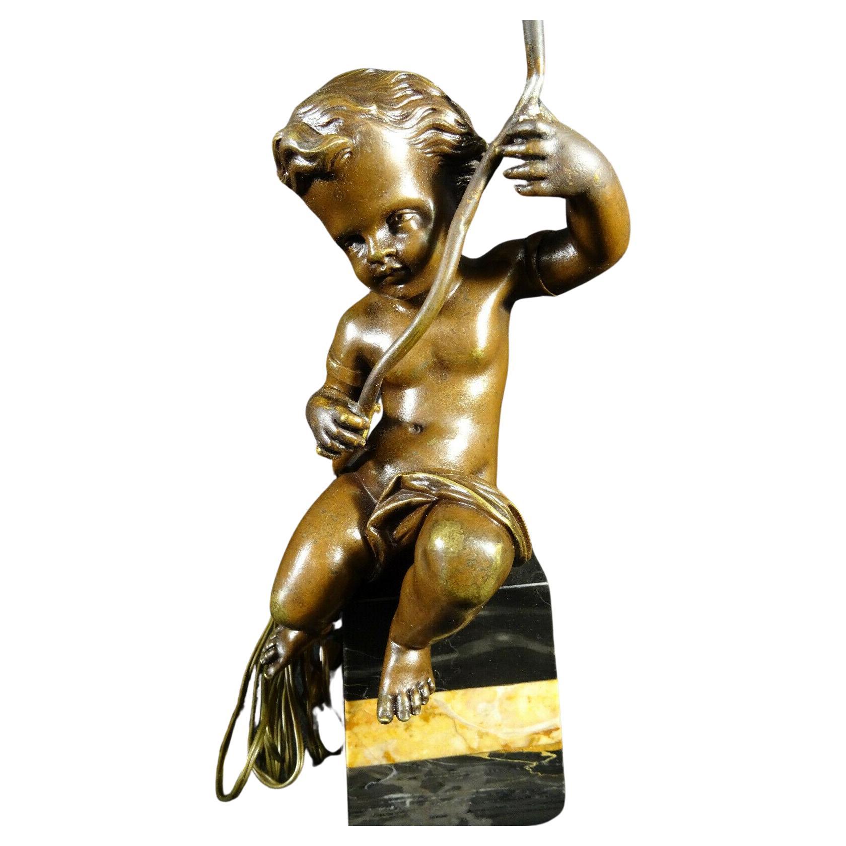 This is a rare French Louis XV style Bronze Cherub Table Lamp. I say rare because all of the body parts of the cherub were seperately cast and applied with hidden screws. I believe around 1854. Stunning lamp. On another listing I have the Cherubs