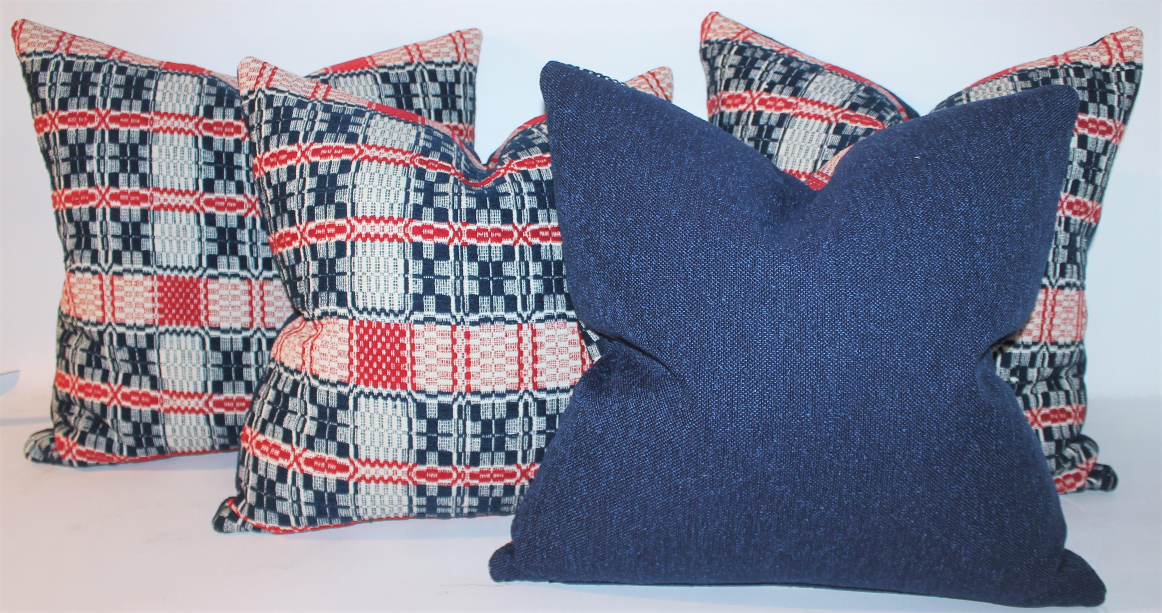 Early woven coverlet pillows with fantastic blue linen backings. The inserts are down & feather fill.