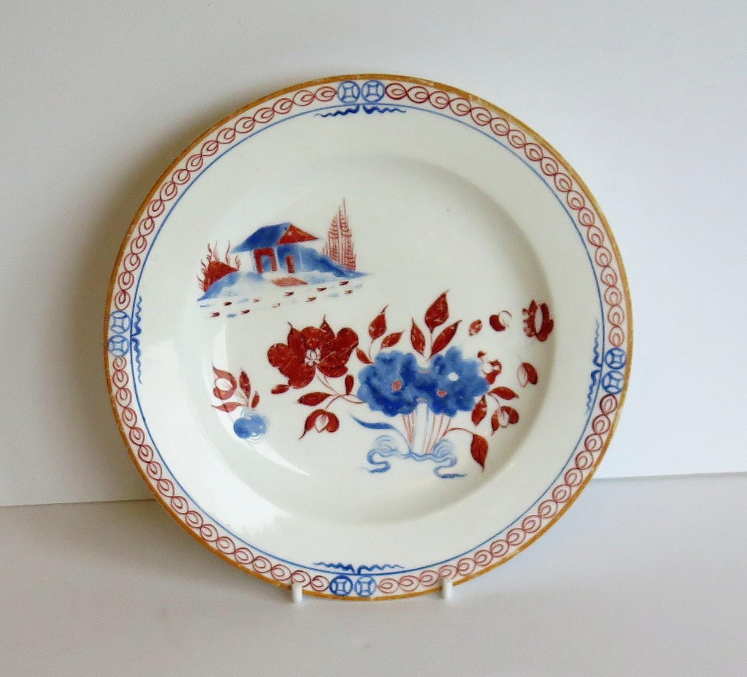 This is a good early English Spode porcelain plate or dish hand painted in the Doll's House pattern, Number 488 and dating to the George 111rd period, very early in the 19th century.

The plate is well potted and raised on a low foot. It is well