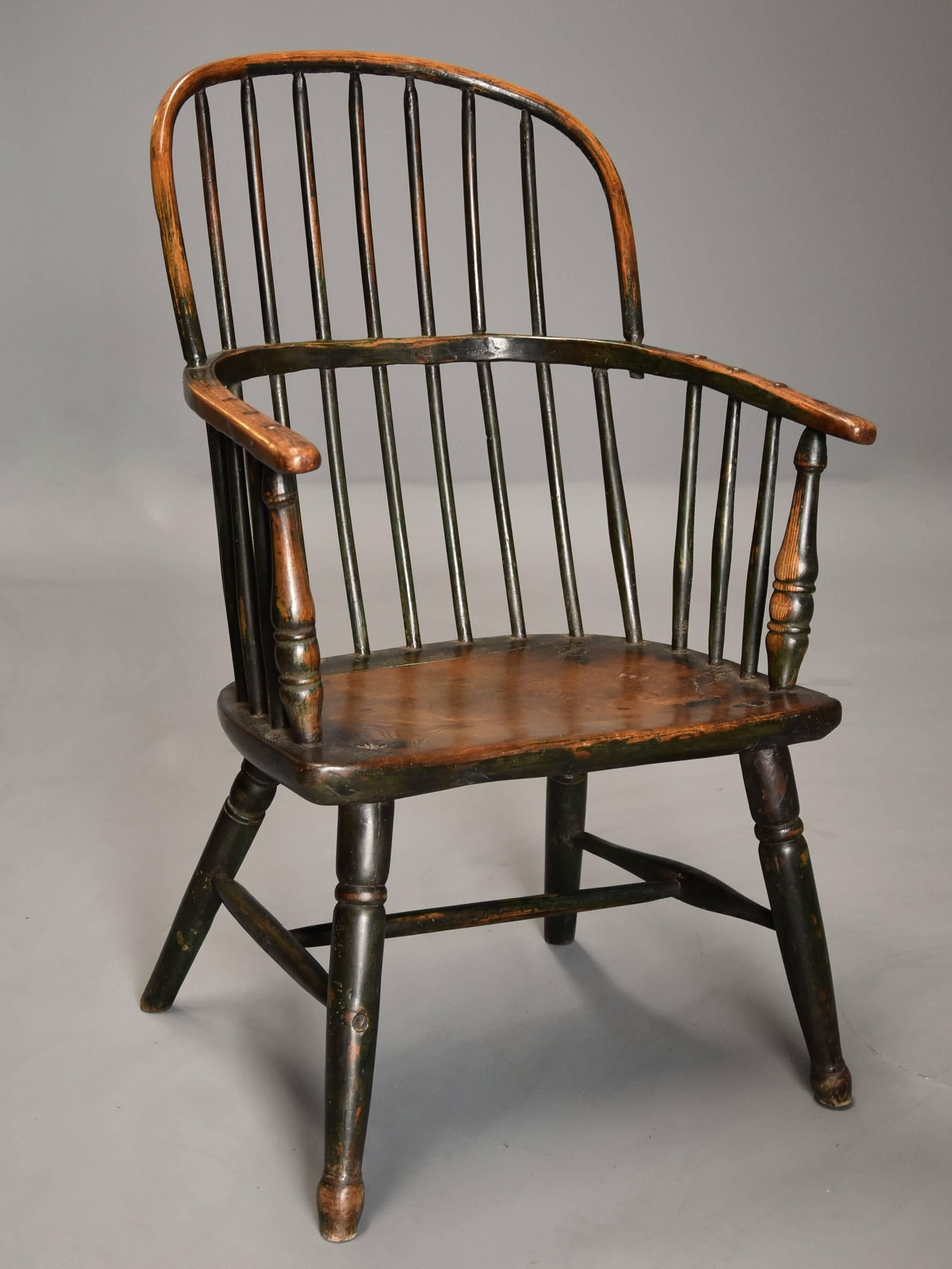 A superb early 19th century West Country ash and elm hoop back Windsor chair with wonderful patina (color) and original green paint finish.

This chair consists of a hoop back with hand drawn spindles leading down to the arm bow with further