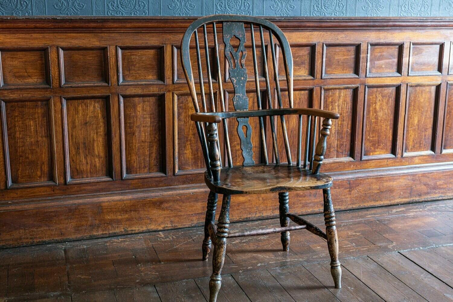 Early 19th century English ebonized Windsor hoop back chair
Ash and elm with lovely wear and patination

Measures: 50 W x 40 D x 108 H cm.