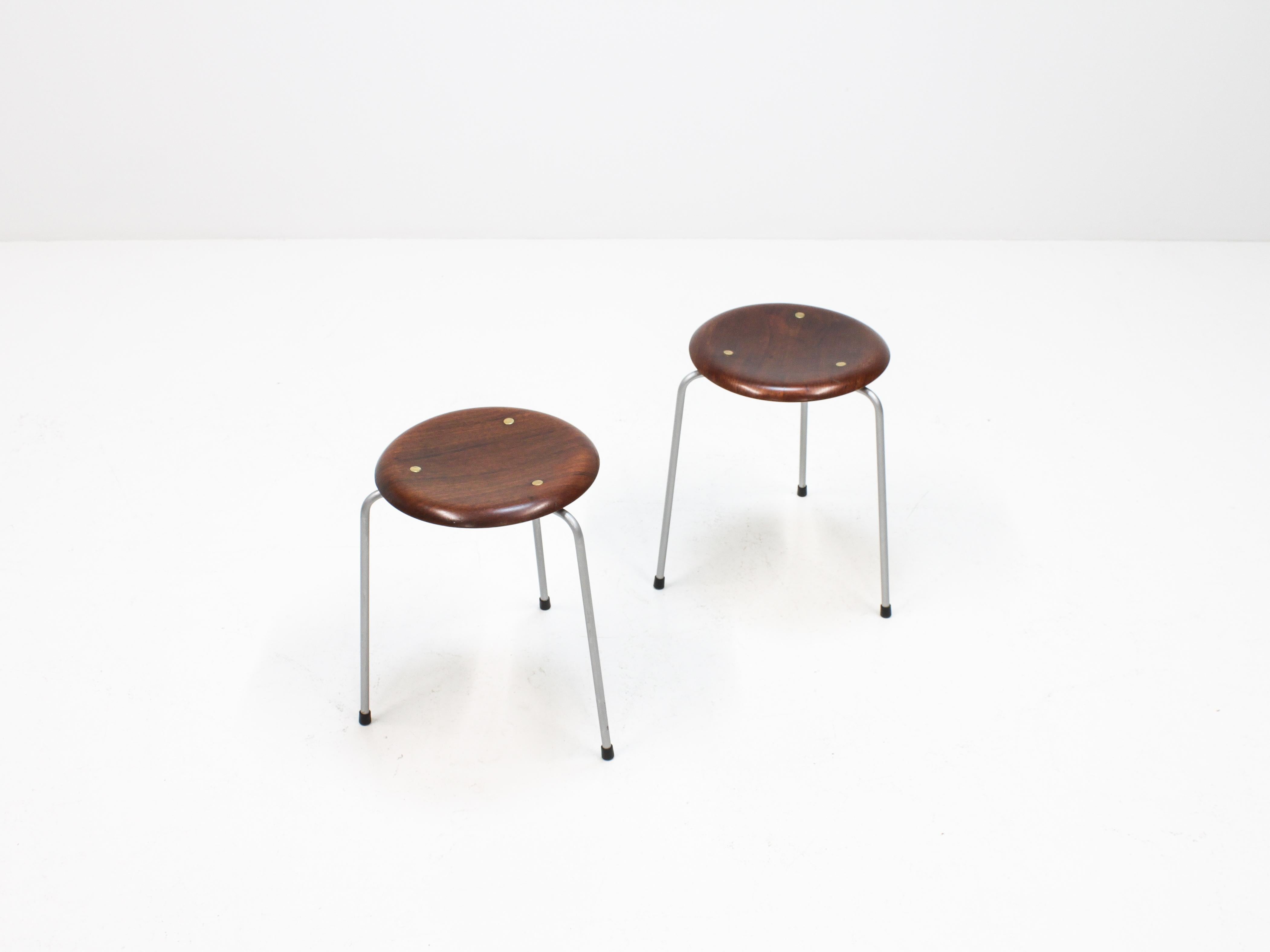 A hard to source early Arne Jacobsen circle/dot stool, first edition with brass dot, dating from the 1950s. 

Stamped 'Fritz Hansen', made from teak and steel.

In good vintage condition, dating from the 1950s please expect some signs of wear in