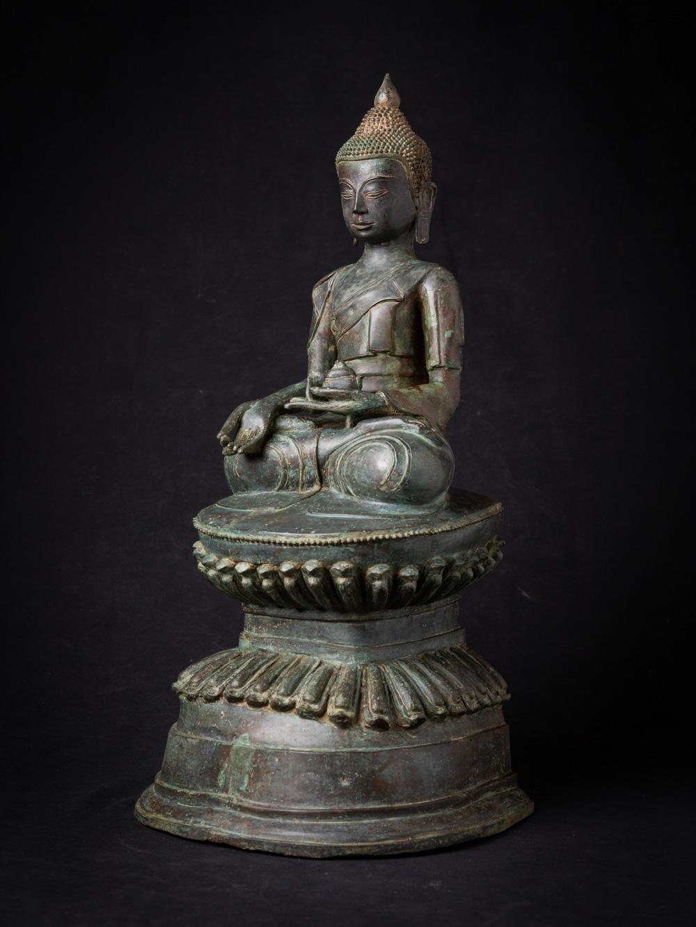 The old bronze Burmese Buddha statue is a captivating and spiritually significant artifact originating from Burma. Crafted from bronze, this statue stands at 56 cm in height and measures 29.5 cm in width and 25.2 cm in depth. The statue is created