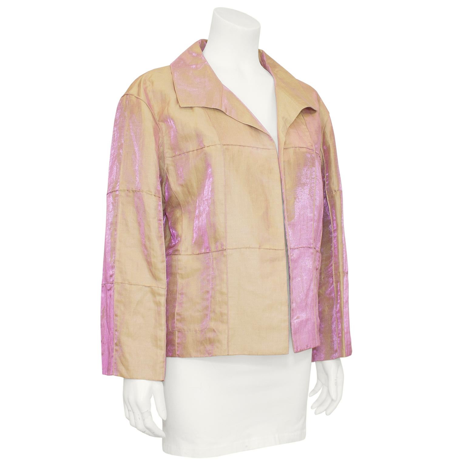 Chanel lightweight beige and pink iridescent silk jacket from the early 2000s. Open front with patch pockets at hips and raised top stitching that creates the look of rectangular patches sewn together. Beige silk lining with interlocking cc logo