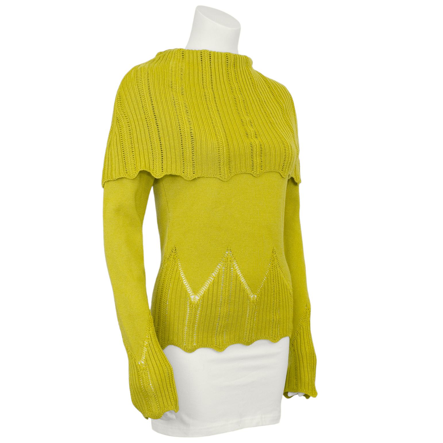 Bright and beautiful chartreuse wool knit Christian Dior pull over sweater from the early 2000s. The sweater is crafted from a tight knit through the arms and body, but the fold over shoulder, cuffs and hem feature a more open eyelet knit with