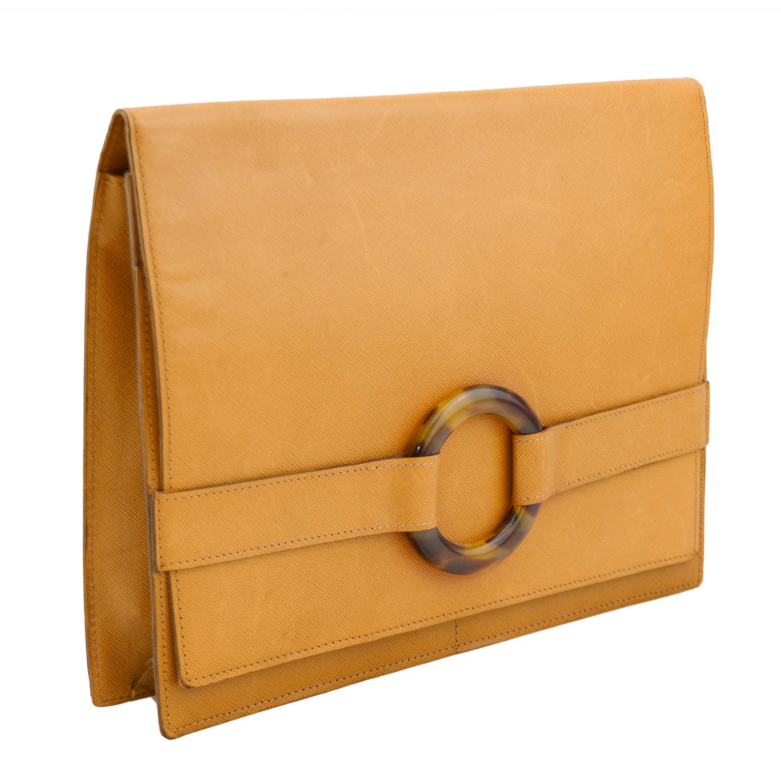 Stunning Christian Dior Boutique Paris envelope style clutch from the early 2000's. Tan rigid cross grain hatched leather with circular faux tortoiseshell hardware. Tan suede interior with slit pocket with zipper. Two exterior slit pockets with